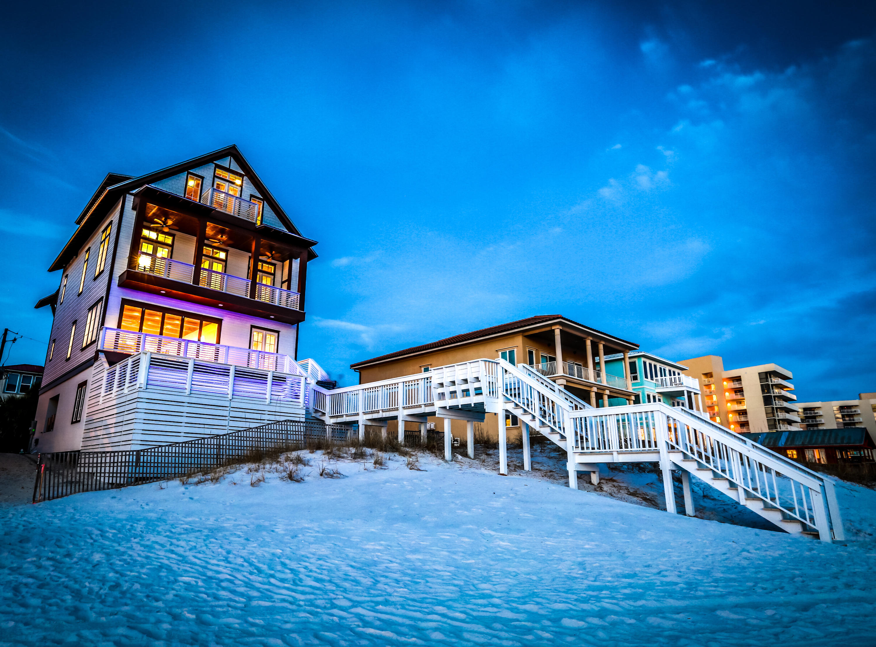 2014-built, beachfront rental winner with a private, beachside pool, distinctive interiors, ownership to the water, and room for a crowd. Perched high above sugary white sands, ''Kate's Porch'' captures breathtaking views of emerald waters from its 4 stories of Gulf-front balconies. The interior's warm, neutral tones and natural materials like wood ceilings and stone tile frame breathtaking views of vivid emerald green waters. Designed for large groups of family and friends, the floor plan provides privacy and convenience in 2 ample-sized living rooms, an attached guest suite with private entrance, 3 master suites, and a 1st-floor wet bar with beverage center. The king master suite encompasses the entire 3rd floor. The 2nd-floor main kitchen with custom backsplash, granite counters, stainless steel appliances, Viking 5-burner range, and large breakfast bar is designed for seamless interior/exterior entertaining. This home is located along a quiet street but near Destin's best dining, shopping, and recreation.