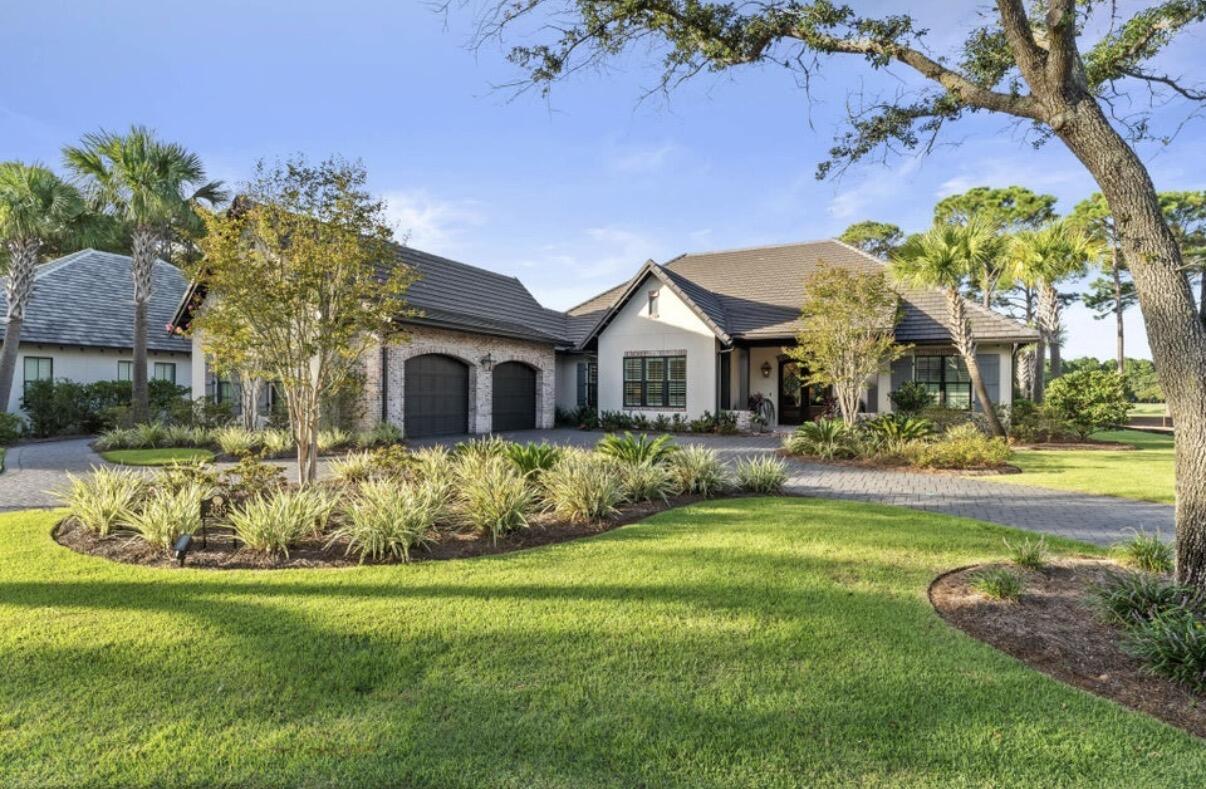 Come take a look at this exquisite one level home located within Sandestin Golf & Beach Resort. Custom built by Huff Homes in the spring of 2019, this home includes all the upgrades and features one could want. The U-shaped driveway and 2.5 car garage makes parking easy and you'll automatically notice the open concept layout and abundance of natural lighting once you walk through the front door. The stunning kitchen features a 10 foot island and luxury appliances such as a Wolf gas range oven & Sub-Zero refrigerator. Beautiful exposed brick flows from the kitchen to the main living area where you'll also find the wet bar. Each bedroom has its own full bathroom offering an abundance of privacy. In the spacious master bedroom, there's an office nook, walk-in closet, his and her vanities, rain head shower, and access to the back patio. One of the best features of the home is the outdoor covered patio which is an entertainer's dream. Enjoy time by the outdoor bar & grill, a cozy fire by the brick fireplace, or in the pool which can be heated when desired. A gas powered fire pit connects over the pool and sets a relaxing ambience. Nestled just along the 14th hole of the Ravens golf course, this partially furnished & single leveled home is in pristine condition and is sure to impress those who enter. Conveniently located inside of Sandestin, you are near the aquatic center, marina, Baytowne Wharf, Grand Boulevard, golf courses, and the beach!