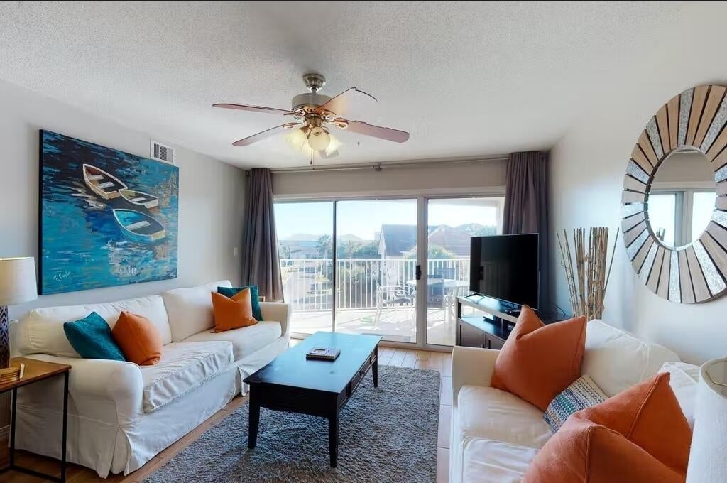 Beautiful updated three bed two bath condo with Gulf Views! Great investment opportunity that averages +$65,000 a year in rental income.
 plank tile flooring throughout for easy maintenance, flat screen TV's in the custom built bunk room, full size washer and dryer, and an owner's closet.  Maravilla continues to be one of the most popular family & pet-friendly communities along Scenic Gulf Drive. Amenities include: private beach access with 2.5 acres of white sand & beautiful turquoise water; 33 acres of land.