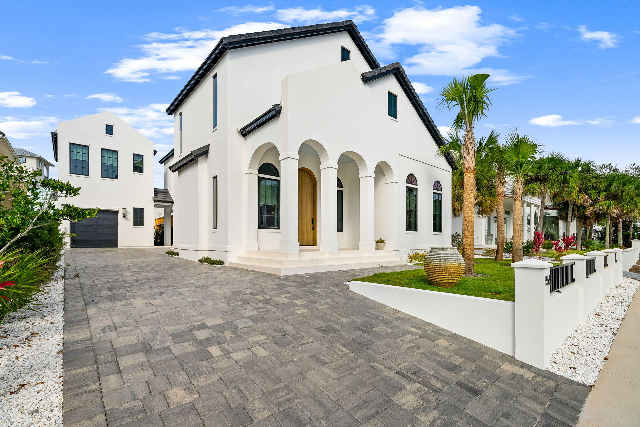 Grand and Elegant, brand new Custom 4br/4.5ba home in one of the most beautiful beachfront subdivisions south of 30-A, The Village of White Cliffs! Named after the white sand cliffs overlooking the Emerald Gulf, the beachfront is spectacular, the amenities are wonderful, and this brand new home is extraordinary. Huge doors show you into an expansive main living area with 20' vaulted ceilings & a fresh modern interior. The open kitchen/dining area boast gas appliances, Sub-zero refrigerator, push open/close cabinets, and a huge island fit for any gathering, large or small. The master bedroom on the main level features a glorious master bath with large walk in closet. On the second level there is another living area with wet bar, and 2 comfortable bedrooms. This upstairs living area could be converted to a 4th bedroom in the main home if desired as well. The carriage house studio and bath is suited well for family and friends, or for overflow guests, or would be a great as a quiet library getaway.
The home is built throughout with ICF construction which creates strong and super insulated home. The owner had the home built for himself, so everything is top of the line, with ceramic tile and engineered white oak heated flooring, beautiful full length tiled walls, a Wolf gas stove and Sub-Zero refrigerator, and even the cement tile roof is all is top of the line! The home features a whole house generator and dehumidifier, as well as on-demand tank-less hot water. And the beach, clubhouse, community pool, and tennis courts are just steps away! With all the restaurants of Blue Mountain Beach and 30-A right around the corner, this home is in a perfect location to enjoy it all!
The Village of White Cliffs ensures the privacy of its owners by being gated and free of short term rentals, so has become over the years a beautiful, private and peaceful beachside community...