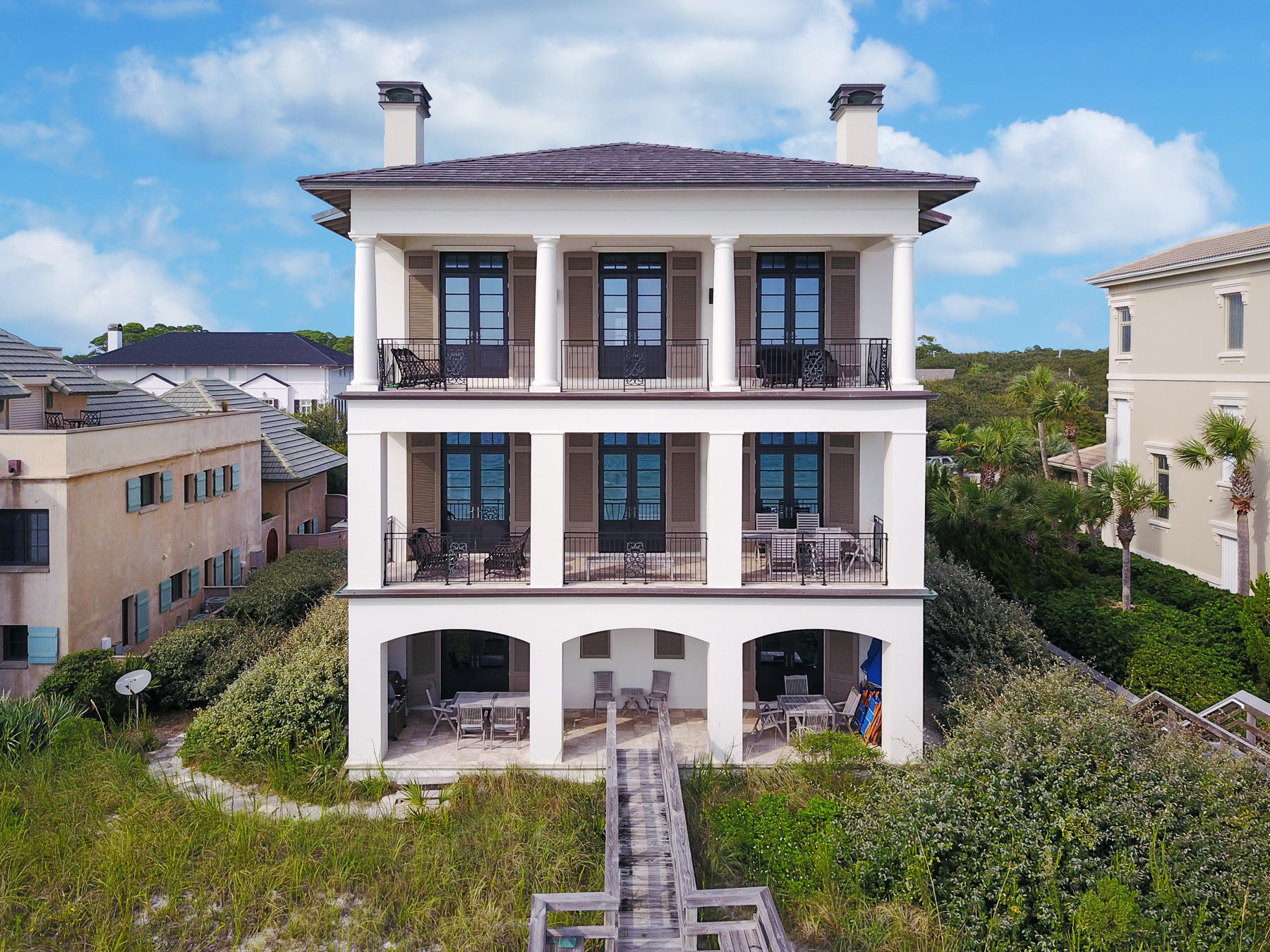 Simple sophistication meets seaside style in this Gulf front 6,500 square foot concrete constructed home. The interior elegance of this villa gives an old world, European aesthetic with a touch of modern refinement with finishes like hardwood and travertine tile flooring, 12-foot raised ceilings with exposed wood beams, hand wrought chandeliers, custom crafted wood cabinetry, matching masonry fireplaces with cast stone mantles and French doors. Although, the design throughout this home is simply divine, the real showstopper is the incredible Gulf front views and private beach access that is directly off of your back porch. Designed by architect Tom Christ, this spacious villa was created for hosting large numbers of relatives and guests. The open living room, dining area and 5 guest suites are perfect for holiday gatherings. A fully stocked gourmet kitchen with Sub Zero stainless appliances, a custom made wet bar with a pressed metal sink and wine cellar, large media room with a Billiard table and a private beach access steps from your home is excellent for entertaining. 
 
This property can be found in the exclusive gated community of Stallworth Preserve, on 30A. It comes with it's own private beach access, incredible views of both the Gulf of Mexico and a rare coastal dune lake and access to all of the local shopping and dining 30A has to offer.