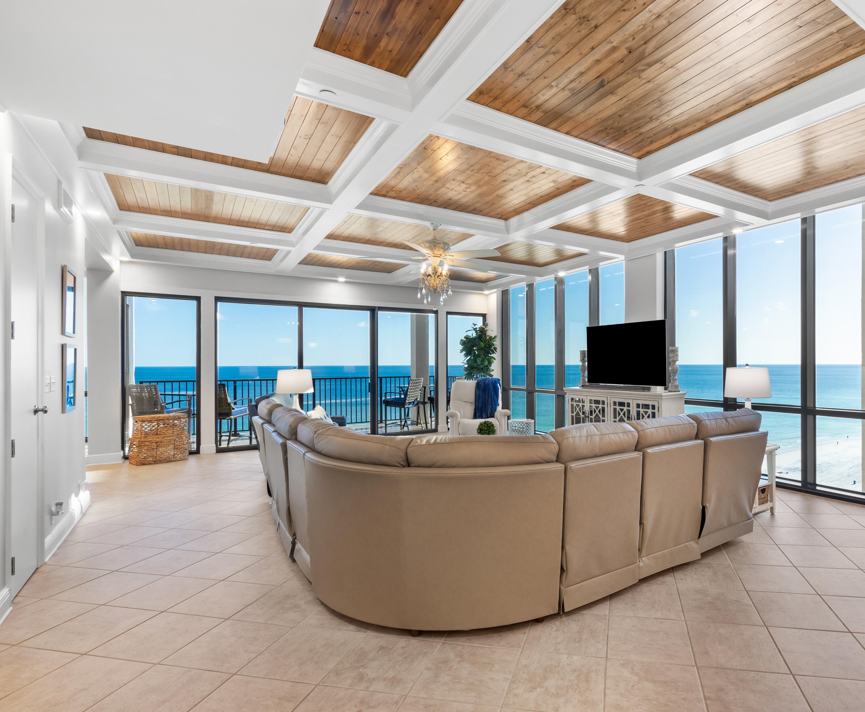 Emerald Towers is a gated Coastal condominium complex located in the heart of Destin.
 Upon entering this luxurious beachfront penthouse, you see the spectacular views of the white sand beach and the emerald water of the Gulf of Mexico.
 The open concept design with 10' ceilings, floor to ceiling windows with UV rated glass and remote-controlled power shades. The coffered ceilings throughout the residence are exquisite!
  This penthouse has 3 bedrooms, 3 ½ bathrooms, expansive living area, large dining room and a sunroom with wet bar. 
 From the living area and sunroom there is access to the large corner balcony with panoramic views.
  Emerald Towers is one of the closest properties to the beach in Destin. Your 200' of beach frontage is only 200' from the pool to the ocean!
More. . . The 23 ft x 15 ft master suite has its own covered balcony.  The master bath has dual vanities, a jetted tub, large steam shower, sauna and 2 walk-in closets
 The beautiful kitchen features high-end LG stainless steel appliances including a GE Café induction cooktop and quartz countertops.
 The laundry
 room is equipped with a Maytag washer and dryer and has double row shelving.
 In the hallway there is a walk-in storage closet.
 Property amenities include, fitness center, sauna, steam shower, heated pool, tennis and pickleball courts, private deeded beach frontage and on-site security.
 Last year the building had a total restoration including concrete repair, all new walkways and balcony surfaces, hand railings and paint.
 Sold turn key and fully furnished (see items that do not convey in documents).
  Rental projection of $155-$185,000 per year as a 3 bedroom.
  Rental projection of $180-$220,000 per year as a 4 bedroom if the sunroom is converted to a bedroom by adding a wall with a door and a closet.