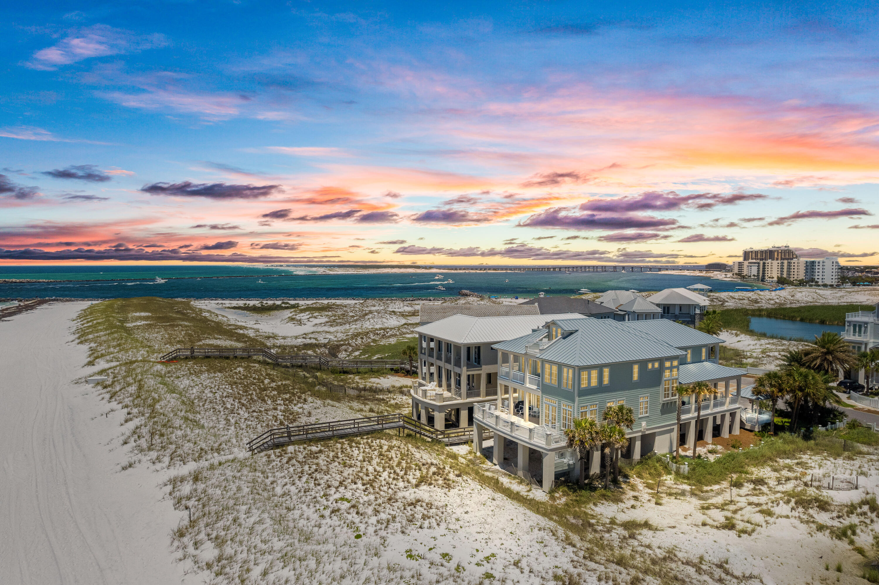 ''Footprints by the Sea''- Impeccably maintained and prominently positioned on the Gulf in Destin Pointe. It offers 70 feet of Gulf frontage sitting directly East of the East Jetty in Destin, with sweeping Gulf views in either direction. Destin Pointe is a gated community with 24/7 security that offers quiet/private beach access. It's a one owner home that was designed by a local architect. Golden Oak flooring throughout, Double car garage, large storage room for beach equipment, beautifully designed ''bump-out'' sitting areas overlooking the Gulf, Wood burning fireplace with mid 1800's Savannah Grey bricks, 2 Laundry rooms, large walk-in closets, wet bar, 3 oversized bedrooms, every bedroom has a double sink bathroom, surround sound stereo, brand new Travertine flooring on the outdoor decks, large storage, elevator, 3 king beds, lake views, solid 8 ft doors throughout. There was a new aluminum roof installed recently along with new paint on the exterior. Each bedroom has a king size bed. 3 can be converted into California twins. The master bedroom and wet bar has an under counter Sub Zero refrigerator and the LR wet bar has a Scotsman Icemaker. The kitchen area has 2 pantries (1 is a walk in). The kitchen/wet bar countertops are custom golden teak wood. The kitchen has upscale appliances including a double oven, Bosch dishwasher, Thermador 5 gas burner stove and warming drawer.