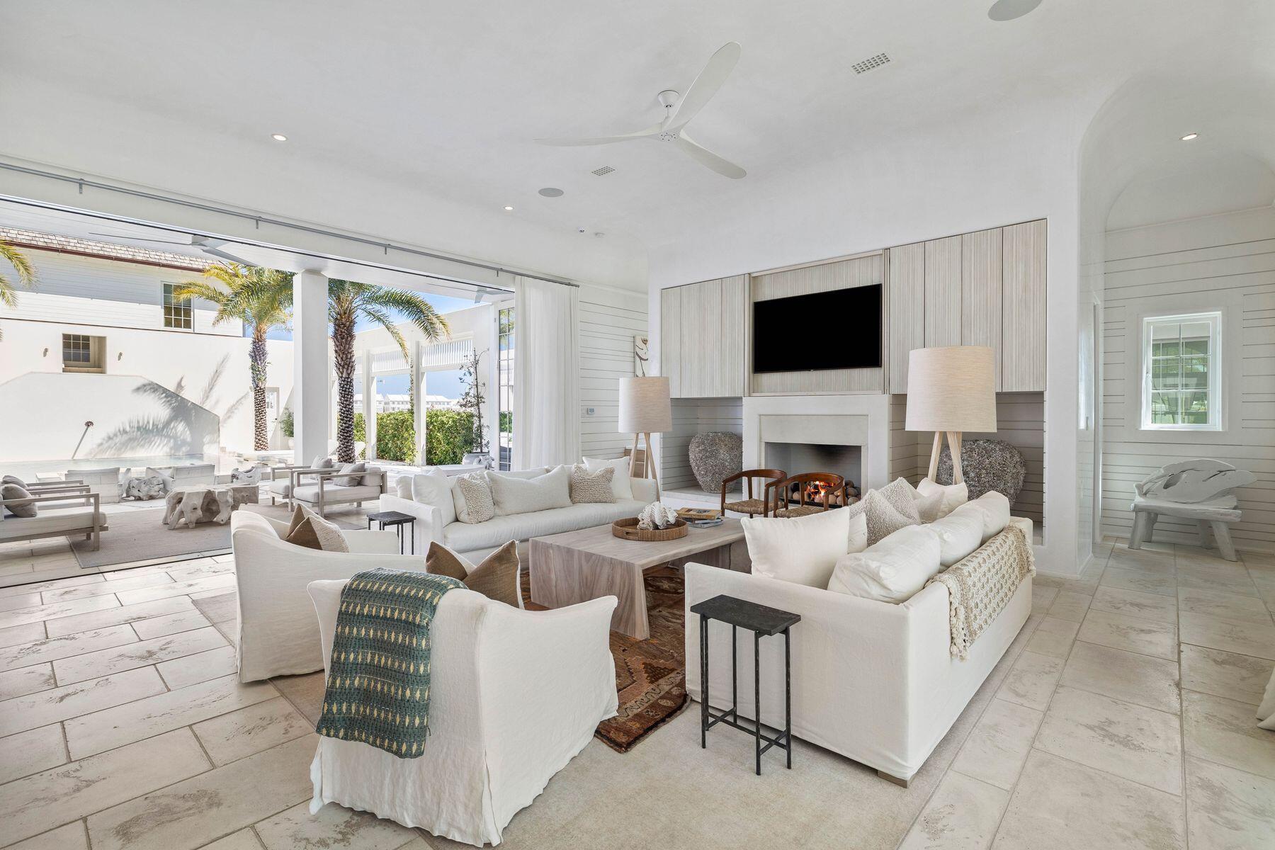 This beautiful residence was the original model concept for extraordinary homes that epitomize Kaiya Beach Resort. The contemporary design creates a light and airy living space with a NanaWall system that fully opens onto a courtyard with pool and fireplace. Every detail is carefully considered, from natural elements of water, wood and stone to the stunning kitchen, which is like no other. This innovative beach house is one of just 22 exclusive residences in the first phase of Kaiya Beach Resort. It's a home for those who appreciate the finer things in life without compromise. Occupying a generous lot, this imposing building has a commanding presence. The second-floor porch is tucked behind screens for the ultimate privacy while relaxing on the swing seat and watching the world go by. The interior is equally avant-garde with 4,000 square feet of open living space spilling into a courtyard garden with palm trees and a statement infinity-edge pool. It's a prime space for entertaining, relaxing and rejuvenating in well-deserved comfort. The custom kitchen includes Caesarstone counters and backsplash, high-quality Sub-Zero and Wolf appliances and state-of-the-art fixtures. An island provides a hub for social drinks and casual dining while the comfy living space is focused on the zen-like fireplace. Venetian plaster, designer furniture, a two-car garage and a luxury carriage house round off the features at this luxurious boutique retreat. The premier neighborhood includes upmarket amenities and a resort-style pool for a leisurely dip. Follow the sandy trail down to the white sandy beach and emerald gulf waters where all the comforts of the Kaiya Beach Club await. Beyond the gates, Alys and Rosemary Beaches offer boutique shopping, fine dining and entertainment along with championship golf courses and state park recreation.