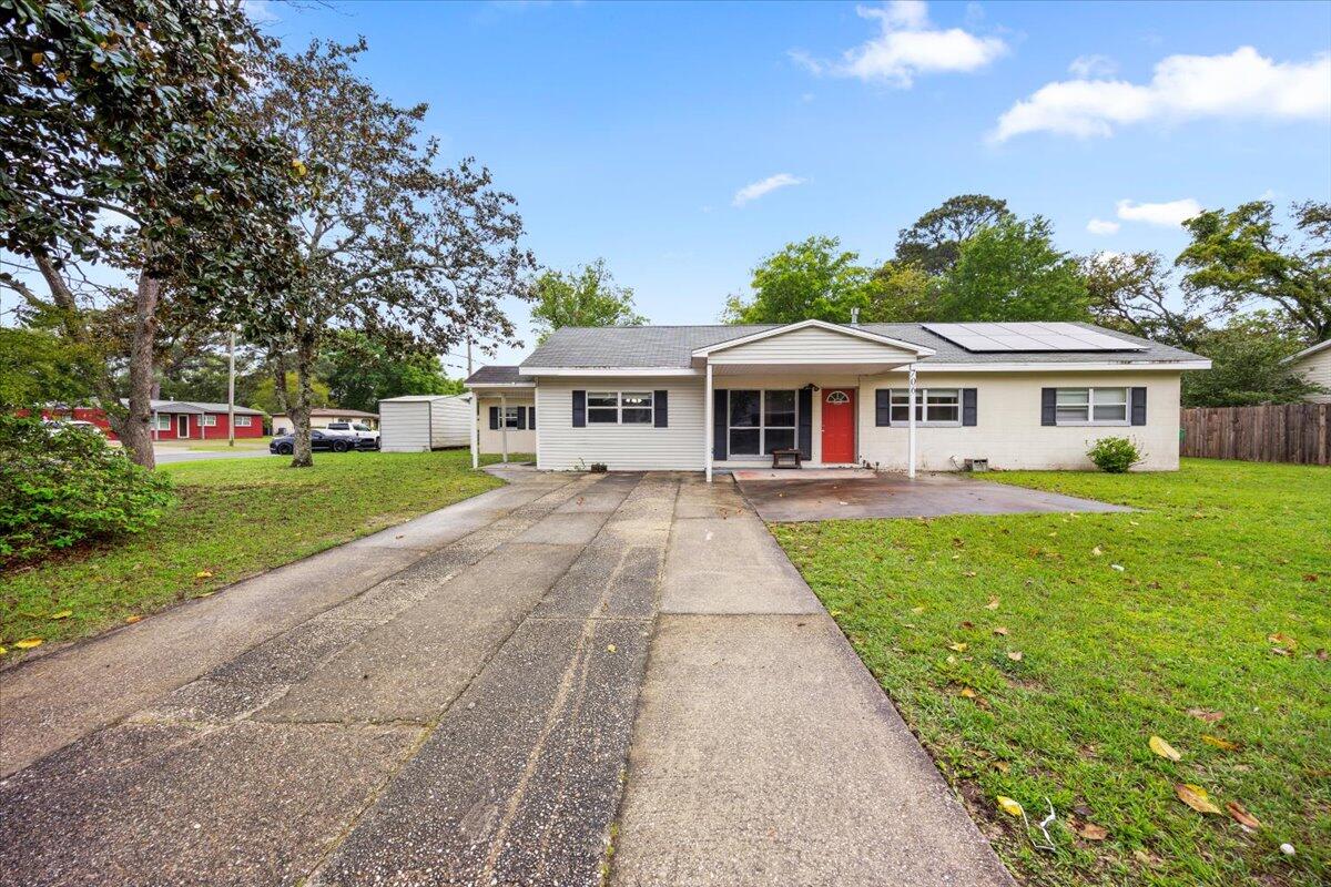 Must-see corner lot in the heart of Fort Walton Beach! 
Spacious 5-bedroom, 2-bath home nestled on a generous 0.25-acre lot at the corner of Mary Avenue and Woodrow Street. This property has so much potential, home offers a flexible layout perfect for families, multi-generational living, or investment opportunities. Inside, you'll find two separate living areas, a formal dining room, a Florida room, and an oversized bedroom ideal for an office, guest suite, or private retreat. Recent updates include a, Roof Solar Panels, new water heater (2024), partial roof replacement (2023).Concrete driveway expanded with a front patio great for entertaining. A second parking pad by the in-law quarters offers parking for up to 5 vehicles, including RV space. While the HVAC system (1993) is still running strong, much of the home retains its original charmproviding a fantastic opportunity for buyers to customize and modernize to their liking.

Conveniently located walking distance to Pryor Middle School and Choctawhatchee High School, this home combines space, location, and value. Plus, you're only 10 minutes from the sugar-white sands of Okaloosa Island and all the Emerald Coast has to offer.
Don't miss out come see the potential and make this home your own!