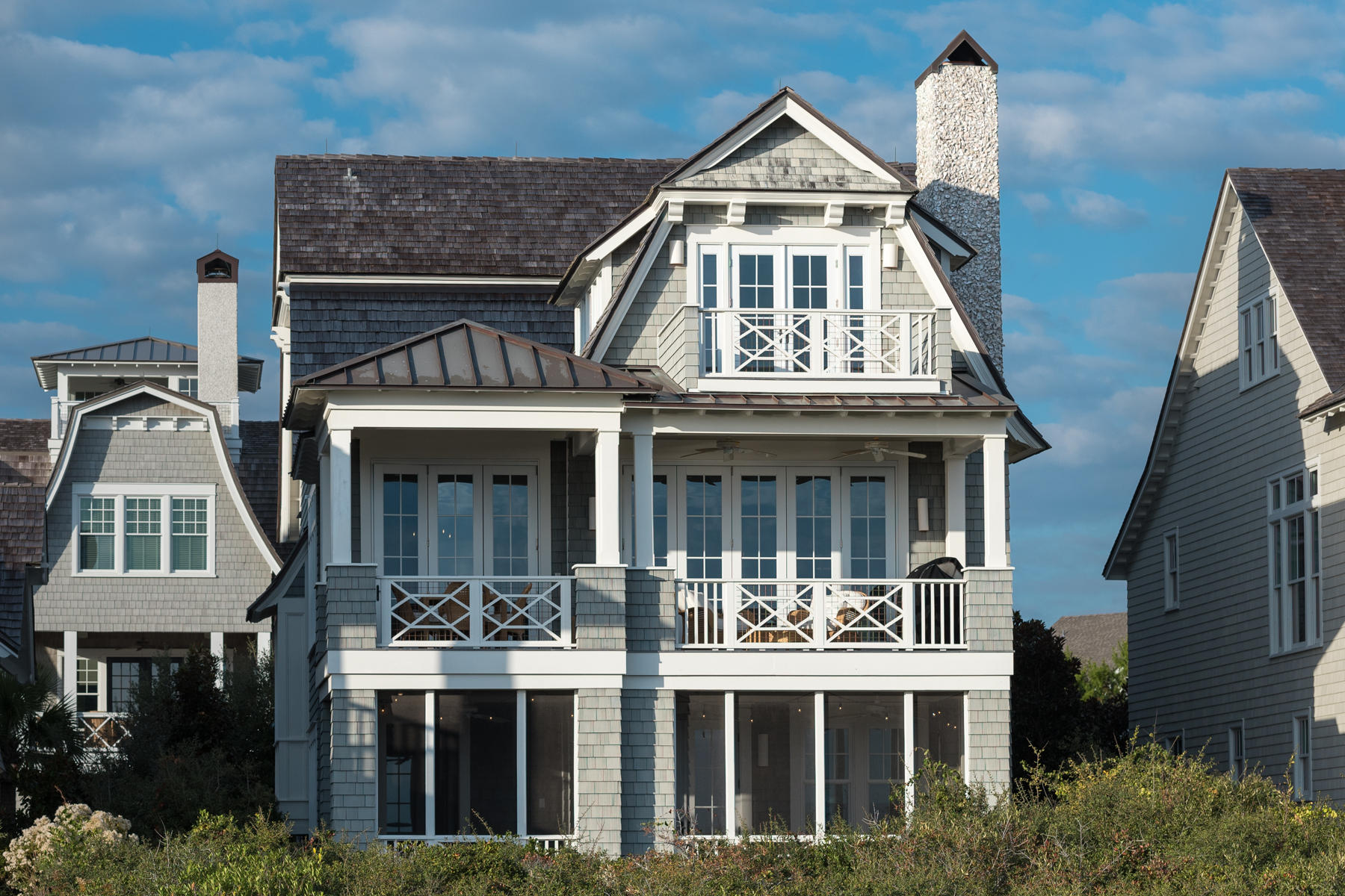 When superior quality, prime location, and spectacular views are desired, this WaterSound Beach home delivers unequivocally. With an all star design team, architecture by T.S. Adams Studio, construction by Davis Dunn Construction, and interiors by Bohlert Massey Interiors, this home is truly a must see. Three levels stand host to open living spaces, five bedrooms and five and a half bathrooms plus outdoor living spaces for mesmerizing views of the Gulf of Mexico. More than 4,000 square feet features true lathe plaster walls, cypress beamed ceilings, french white oak and coral stone floors, private elevator and marble countertops. NanaWall systems allow the exterior doors to fold like accordions to blur the juncture of indoor and outdoor living spaces. The second floor is home to grand entertaining spaces, an exquisite gourmet kitchen, and wine cellar. Calacatta gold marble counters and custom white oak cabinets contrast comfortably with the glass tile backsplash and high-end appliances in the exquisite kitchen with a near by generous butlers pantry.  The master suite occupies the entire third floor.  Complete with a private balcony and large spa like master bathroom makes it the perfect retreat for complete relaxation.  The first floor embraces a second master bedroom with screened porch, bunkroom with its own private bath, additional guest bedroom with private bath, and a media room. Adjacent carriage house includes living area with kitchenette, bedroom, and full bathroom.