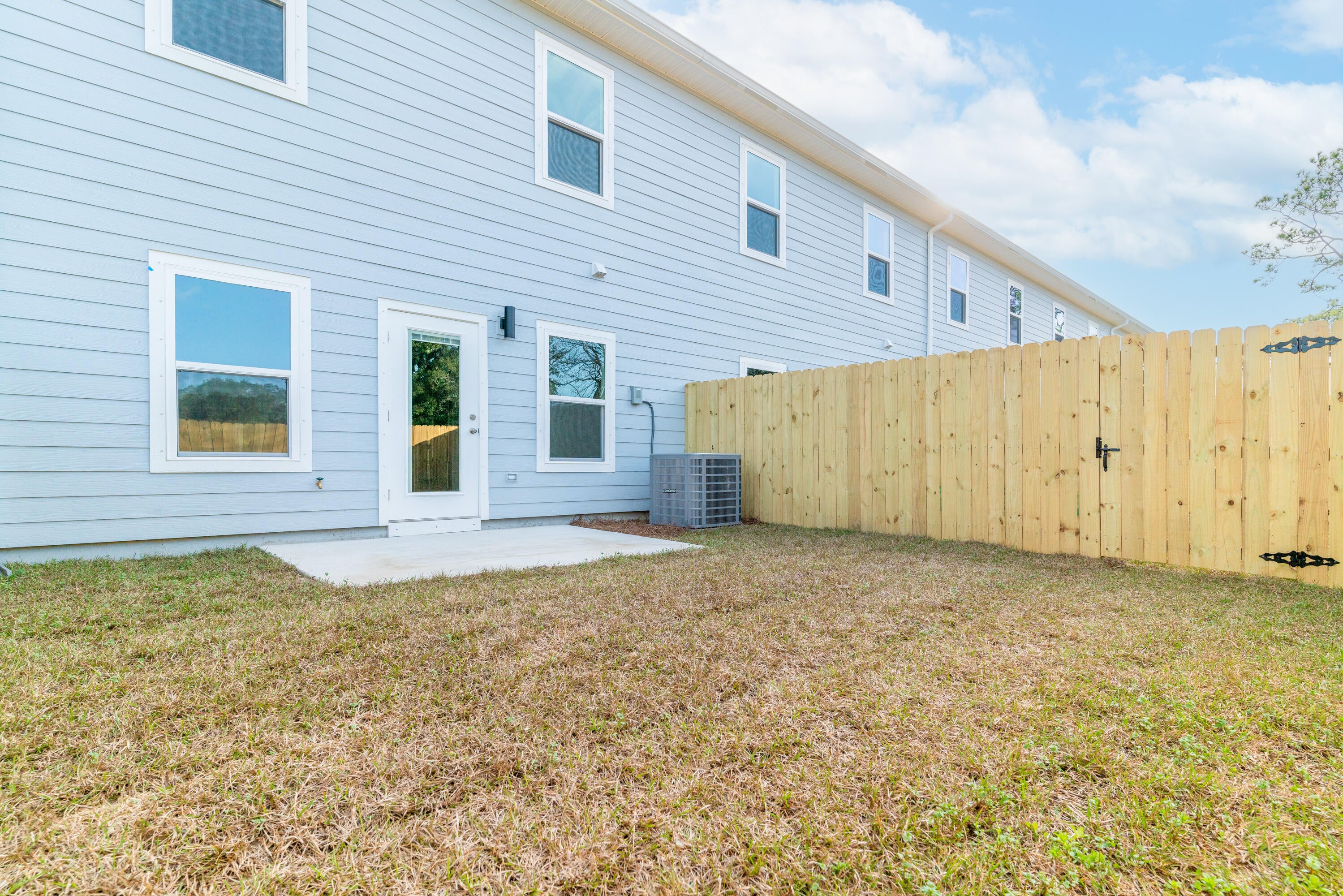 New Construction & Ready to Move In! Builder is giving $10,000 ANYWAY MONEY which makes this a $0 move in if used towards closing costs! Use this money towards an Interest Rate Buy Down, closing costs, and/or down payment!  INTERIOR UNIT in an 8-unit building.  Luxury Vinyl Plank in living areas & baths. Carpet on stairs & in bedrooms. As you enter, stairs lead  to 4 bedrooms, full guest bath, on-suite bath for primary & upstairs convenient laundry room. Downstairs hallway leads to ½ bath, kitchen w/ breakfast peninsula & Upgraded Stainless Appliances such as side by side refrigerator, Self-Cleaning Convection Stove w/ Air Fry, built-in microwave/range hood & dishwasher. Kitchen opens to the living & dining room. Back door leads to privately fenced backyard with a gate on either side.