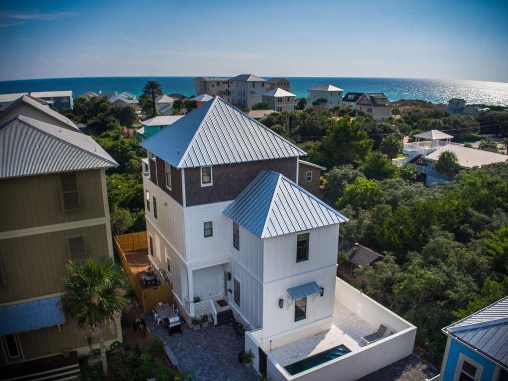 23 Bluewater View Ave, in popular Inlet Beach, is the perfect, luxury beach home offering fabulous gulf views from its second and third floors. It's uniquely located a few blocks from the beach and just east of iconic Hwy 30A.  There are two master suites with king beds (first and second floors), a king bedroom (first floor), and two bunk rooms with four twin sized beds in each room (first and third floors).  The bunk rooms each have adjoining bathrooms.  Relax and watch the kids swim at the home's private salt water pool.  Let the elevator do the work for you with a ride to each floor.  Enjoy the third floor's oversized deck and summer kitchen- a cozy spot that's perfect for sunsets and sunrises alike.   The open gathering space on the second floor includes a living area, exquisite kitchen, and dining area with seating for ten people. The spacious and sophisticated chef's kitchen is meant for entertaining with a six burner Thermador stove/oven, sleek, solid white quartz counters, and an oversized island that seats five people.  All high end furnishings, finishes, and lighting were intentionally chosen by Crowell & Co Interiors in Nashville.  View more photos of this home on the company's website- www.crowellinteriors.com.  23 Bluewater View Ave has an established rental history and no HOA fees.  It sleeps 14.  All dimensions shall be verified by the buyers.