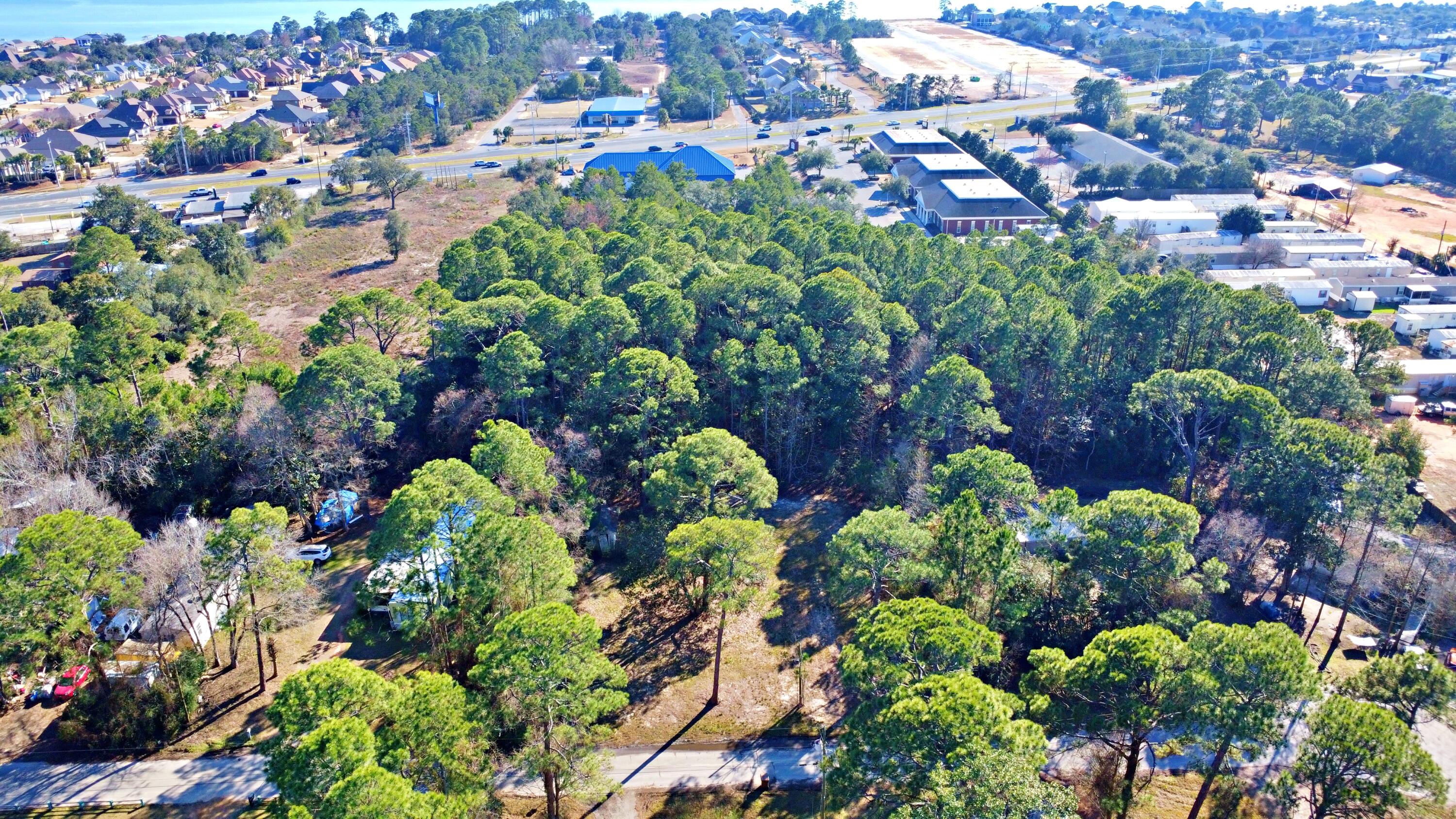 Cleared and build-ready vacant lot totaling approximately 0.4 acres, ideally located just off Highway 98 in Navarre. Electric and water hookups are available, providing a convenient starting point for future development. The property offers easy access to major roadways while maintaining flexibility for a variety of residential plans, subject to local zoning and permitting requirements.

Two adjacent lots are available for purchase, presenting an excellent opportunity for expanded acreage or investment. Buyer to verify all utility availability, zoning, land use, setbacks, and building requirements with the appropriate authorities.