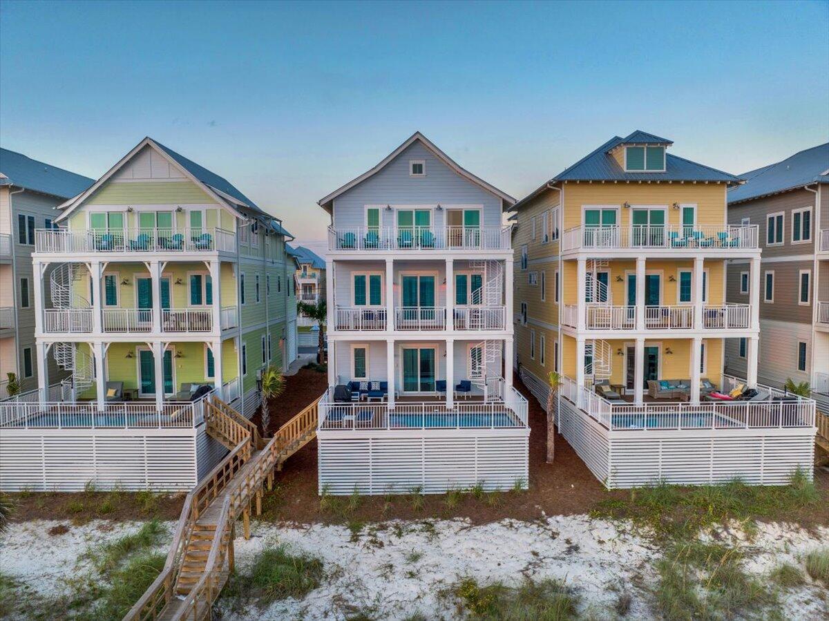 Enjoy your time at PCB's Margaritaville Resort in one of the Best Gulf Front Luxury Beach houses in the Resort, this NEVER RENTED until was customized by the owners with a different furniture package and decor to make it special.  The Oasis Floor Plan features offers 3784 SF of living space with an endless view from each balcony and offers two master suites on the Third Floor.  The First Floor offers a Recreation Room with a Mini-Kitchen and a gaming area with Pool table, bunk room and an Elevator.  The second floor features the living area with an open Great Room, that opens to an oversize balcony with endless views both East and West.  Two Bedrooms with Ensuite Baths and a large Laundry with additional storage.  The Third Floor offers three bedrooms, all with ensuite baths with two being Gulf Front.  All this with and as well the amenities of Margaritaville PCB Resort including The Salty Rim Bar & Grill, Fins Restaurant and Bar, (opens in 2024) and a 425' lazy river Lagoon Pool that is Margaritaville's signature at each of their Resorts.  Get ready for good times as it's 5 O'clock somewhere at Margaritaville.