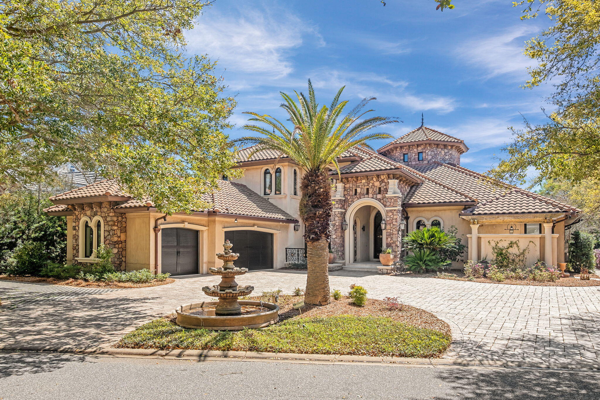 Built with the highest quality Insulated Concrete Form (ICF) construction, 437 Admiral Court is a palatial estate located on a quiet lake in Regatta Bay, Destin's premier gated golf course community. This custom-built home boasts some of the highest quality finishes that can be found on the Emerald Coast; the exterior is adorned with pecky cypress corbels, ipe decking, a commercial-grade space heater, outdoor chef's kitchen, screened-in lanai, and an Italian
tumbled paver driveway. The impeccable quality of materials extends to the interior of the home
which is highlighted by custom mahogany kitchen cabinetry, a stunning mahogany-panelled
home office, imported Calcutta marble flooring, a Eurowall that connects the indoor and outdoor
living areas, walk-in butler's pantry temperature controlled wine storage, and a THX-certified
home cinema with seating for eight along with a separate kitchen. The home also has a geothermal heating & cooling system and high-end appliances such as a 63" SubZero refrigerator, 48" Wolf Range, & a commercial grade steam room in the primary suite.

The curb appeal of 437 Admiral Court is unmatched with carefully curated landscaping, gorgeous imported Italian tumbled stone paver driveway, three-car garage, a 15' grand archway framed with gas lanterns, and pecky cypress corbels adorning the garage and street-facing exterior walls.

Upon entering the home, you're greeted with Calcutta marble flooring, and a tranquil indoor water feature that's framed by a 15' barreled ceiling. The fresco-painted dining area exudes
refined elegance and coastal charm, while the 30' ceiling in the grand sitting room is reminiscent of the nobility and refinement of the Renaissance era.The entire home is wired with fiber optic
cable and smart home technology, so it combines old world beauty with modern technology and convenience. Past the dining room is the built-in mahogany bar complete with a glass-encased
& temperature controlled wine room that's perfect for displaying rare vintages. The bar seamlessly connects to the kitchen via a cross vaulted ceiling. The kitchen boasts custom mahogany cabinets, Wolf & SubZero appliances, and a walk-in butler's pantry all framed by
striking Siena marble countertops. The kitchen & living room combine to create an ideal space for entertaining, and the Eurowall that adjoins the living room and outdoor area makes it an
even more dynamic space. 

When your guests step outside the Eurowall they'll be greeted by stunning Ipe flooring, a fully equipped outdoor kitchen, outdoor gas fireplace, and a 20'x15' heated pool complete with waterfall features. The outdoor seating area also features a commercial grade heater so that the space can be utilized year-round.

The first floor has an ideal bedroom layout for privacy; the master wing occupies the majority of the right side of the home and there's a separate full guest suite off the garage on the opposite
side of the house. This guest suite essentially functions like an attached carriage house because it has its own side door entrance, and it's also directly adjacent to both the garage and
the sizable walk-in laundry room. The master suite is a masterclass in luxury complete with a private wet bar, heated marble
flooring in the bathroom, a commercial grade steam room, two separate full-sized vanities, walk-through shower, and a zero-edge jacuzzi spa. The master suite also has a private fireplacethat frames a sitting area with views of the pool and the lake. The two walk-in closets are accented with custom built-in cabinetry and a sizable Carrara marble & mahogany island.

The grand staircase serves as a focal point in the home & crescendos with a Juliette balcony that's positioned to enjoy views of the custom-painted medallion ceiling that's inlaid with twinkling fiber-optic lighting. The home is equipped with an elevator as well. The second level guest suites each have their own full baths attached as well as walk-in closets. The THX-certified home cinema system is outfitted with the highest quality sound and visual systems. It also has an attached full bathroom, guest suite, and its own kitchen.

437 Admiral Court truly has some of the highest quality construction materials and finishes of any home on the Emerald Coast. No expense was spared and every detail is a marvel. Schedule your private tour of this 2010 Parade of Homes award winning masterpiece today.