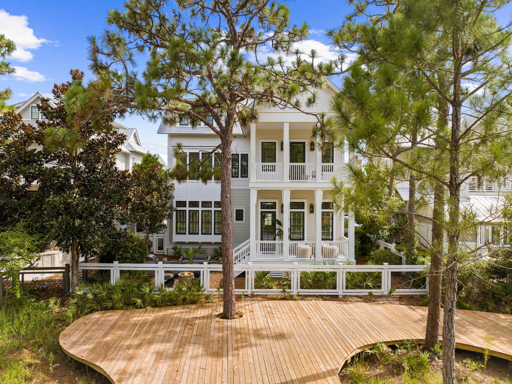 Beautifully secluded in WaterColor Phase III, just steps to the Frog Pool, over the pedestrian bridge to the Boathouse and moments away from the WaterColor Beach Club with multi-level pools, restaurants, bars, and private access to the sugar white sands of the Gulf of Mexico. This recently updated Beach House with over 4,000 Sq. Ft., 5 Bedrooms, 5 Full Baths and Half Bath is perfectly placed in the ever-popular Lake District. All the guests will enjoy the private pool, large family size kitchen, seated dining for 10, ping pong on the porch, firepit with additional lounge area overlooking meandering boardwalk path that winds throughout the community. The independent private guest suite overlooking the pool with full bath and morning bar, complete with mini refrigerator and rocking chair front porch give privacy to its guest. The third floor has several opportunities to create a living space, work space and a Queen bed with sitting area and full bath. The home is offered completely furnished and ready to enjoy along with all WaterColor and Scenic Hwy 30A has to offer.