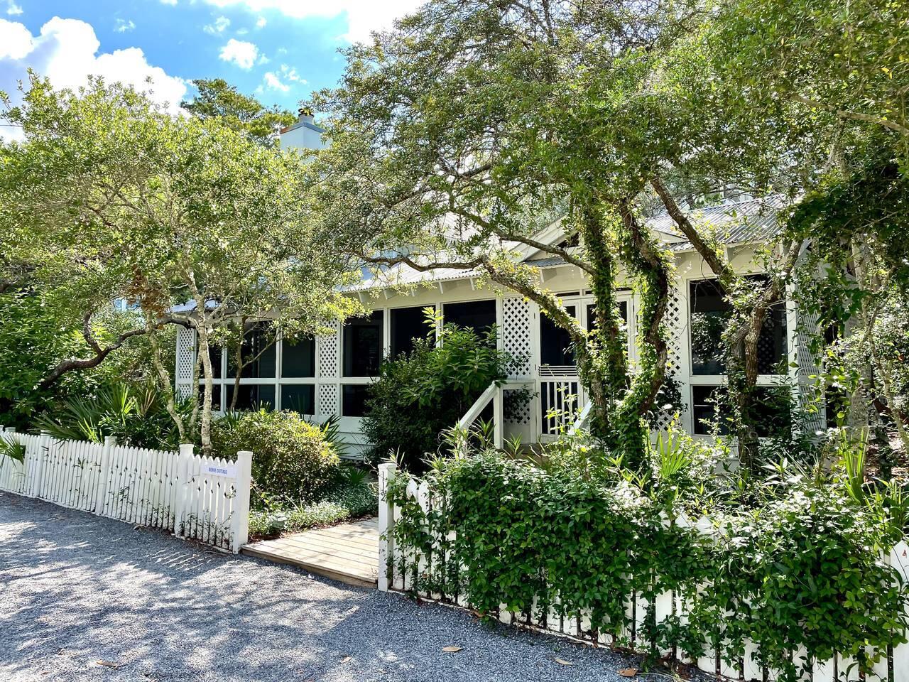 Conveniently located one block from the beach, the Berke Cottage is also just a stone's throw from two pools, the fitness center, playground, etc.  Situated on a large, beautiful lot, there is plenty of room for expansion, as well as off-street parking.  The value in this property is the myriad ways to develop it.

The first to greet you is the oversized front screened porch- which will definitely become your favorite outdoor living space.   The first floor of the cottage offers kitchen, living area with a fireplace, dining area, a bedroom with two twins, and a hall-bath.  A loft above the great room will beckon the children as a play area or could be used as an additional sleeping nook.  The Second floor offers the master suite with queen bed and ensuite bathroom. Access to the tower is also available from this level.  Both bedrooms open onto a private porch or deck, and the all-wood interior offers easy care and durability.

The tower offers multiple uses.  Originally designed as a "bunkhouse" for the kids, it could also be redesigned as a self-contained guest house.  Presently three levels, there's a half bath on the first floor adjoining an outdoor shower. The second floor has two sets of built-in bunks, while the third floor provides an open gathering space.  Nancy Drew art adorns the walls on all three floors.

Fun Fact: The cottage is named for architect Deborah Berke, who designed this property and played a major role in the evolution of Seaside. Berke currently serves as the Dean of the Yale School of Architecture.