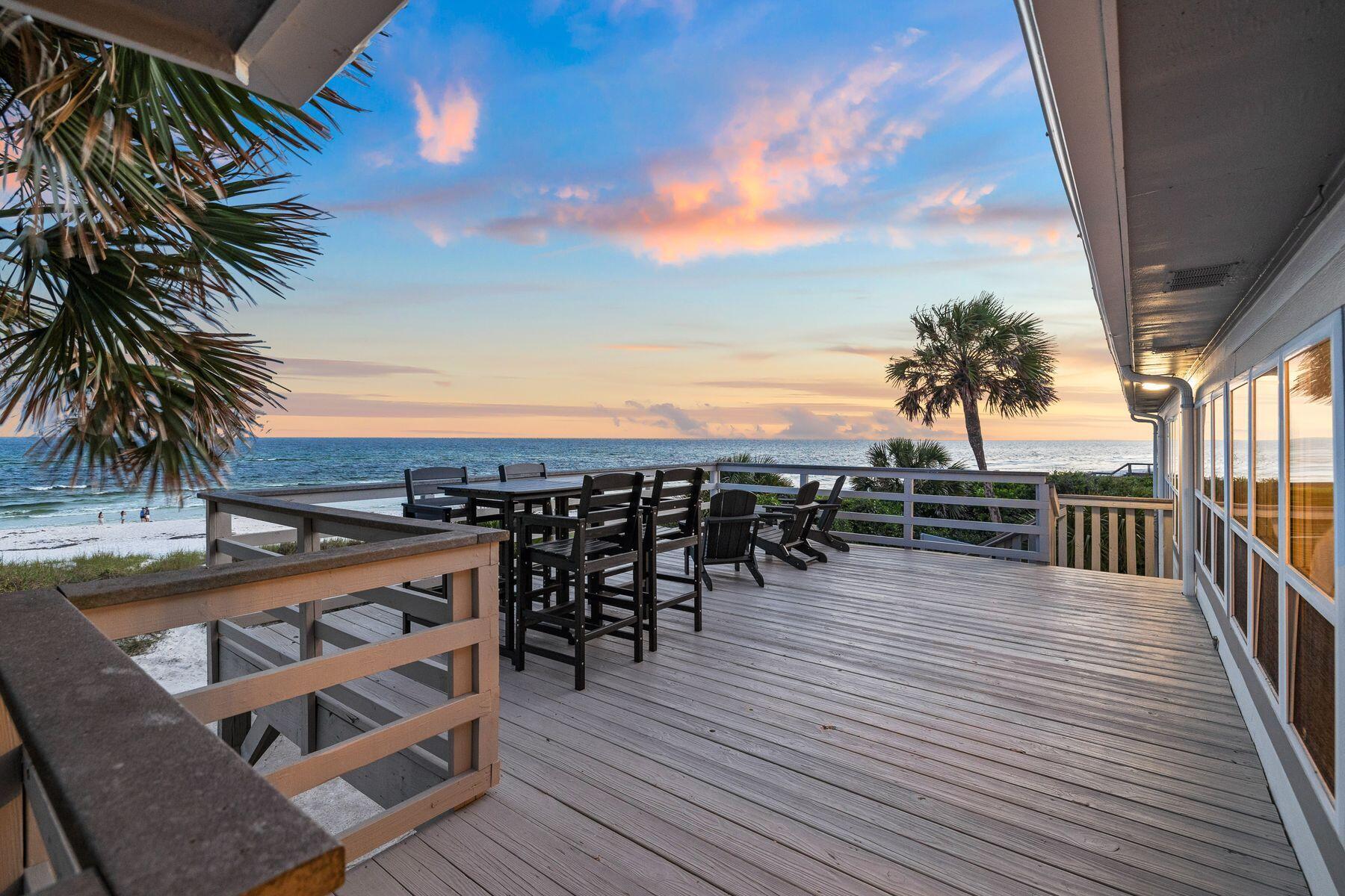 This gulf-front home is all about location. It offers an excellent opportunity to rebuild or add on and create your own dream beach house. Occupying an almost quarter-acre lot, this exceptional five-bedroom property is nestled at the end of the street, boasting unrivaled privacy and seclusion. The emerald Gulf of Mexico laps the white sand just 50 feet from the driveway. With no HOA, there's ample space to dream big, expand, add a pool and carriage house, or even rebuild. The current floor plan includes two spacious open living spaces, one on each level. The second-floor living room has gleaming wood-look flooring and a wall of windows framing breathtaking beach and gulf views. Both levels have fully equipped kitchens, light and airy bedrooms, and modern bathrooms, making the home ideal for multigenerational families or larger groups to share. There are plenty of quiet nooks for reading and there's a large laundry room with lots of additional storage. The expansive upper deck provides the ultimate gathering place with panoramic gulf views from sunrise to sunset. The large backyard and shaded gazebo are designed for entertaining, barbecues and alfresco living just steps from the waves. Rosemary Beach and Alys Beach offer endless dining, boutique shopping and live entertainment nearby while Camp Helen State Park provides access to nature and watersports on nearby Lake Powell, a rare coastal dune lake.