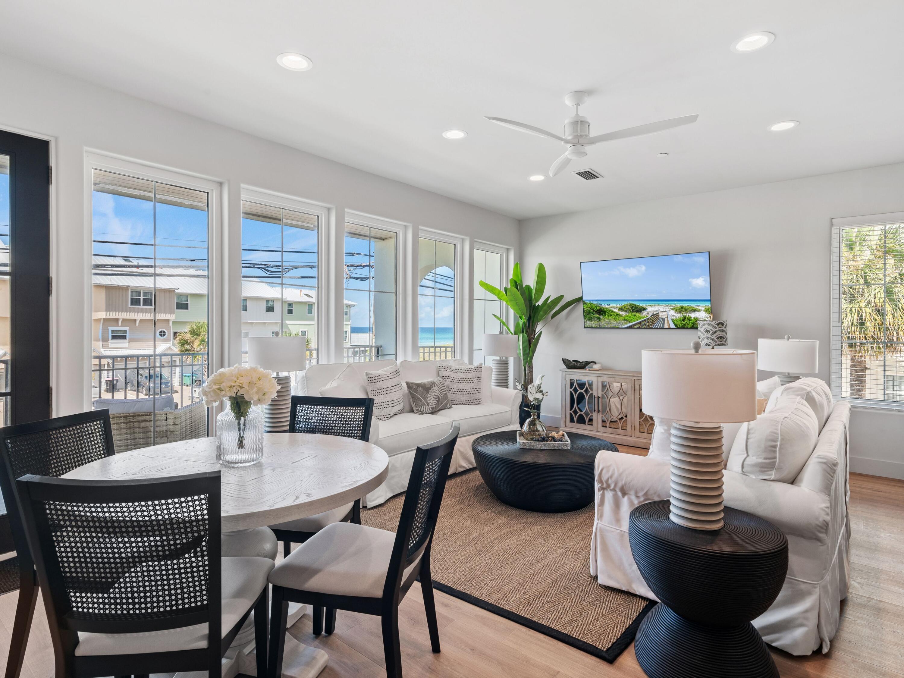 Experience elevated coastal living in this brand-new, fully furnished 4-bedroom, 4.5-bathroom townhome spanning 2,469 square feet, located directly across from the beach in the heart of Laguna Beach on Panama City Beach's serene west end.

Every detail of this residence has been curated for luxurious comfort and refined coastal style. Each unit has been fully outfitted with local designer finishes, blending texture, tone, and quality craftsmanship to create a truly turn-key experience — whether you're seeking a personal retreat or a high-performing rental investment.

Wake up to sweeping gulf views from your primary suite, complete with its own private balcony — ideal for morning coffee or evening sunsets. The thoughtful layout also includes a second primary suite, a spacious king bedroom, and a custom built-in bunk room to accommodate guests in style and comfort.

Inside, enjoy an airy, open-concept living space that flows onto a tiled balcony framed by natural V-groove ceilings. Premium features include GE Monogram appliances, gas cooktop, solid core doors, private elevator, and ensuite bathrooms for all bedrooms. The home is constructed with concrete and wood, with reinforced rebar-filled, 8" concrete separation walls for added soundproofing and structural integrity.

Additional highlights include a two-car garage, two-car carport, and access to a community pool shared by only five townhomes.

Built to exceed expectations, the home incorporates advanced systems like Gold Bond waterproof sheathing, Schluter bathroom waterproofing, concrete band headers, and an individual fire suppression system  combining peace of mind with enduring value.

Unmatched Location & Lifestyle: Perfectly positioned just a short stroll to Thomas Donuts and Carousel Grocery, this west-end gem is also less than 3 miles from Pier Park  Panama City Beach's premier shopping, dining, and entertainment hub. Explore over 120 stores, Grand IMAX Theatre, Dave & Buster's, and SkyWheel, with exciting new attractions like Topgolf and Dolly Parton's Pirates Voyage Dinner & Show on the horizon.

And when you're ready for more upscale coastal charm, the famed beach towns of 30A are just 15 minutes away, offering boutique shopping, award-winning dining, and timeless Florida beauty.

This is more than a home  it's a lifestyle defined by design, comfort, and convenience. Schedule your private tour today and step into a fully realized beachside retreat.
