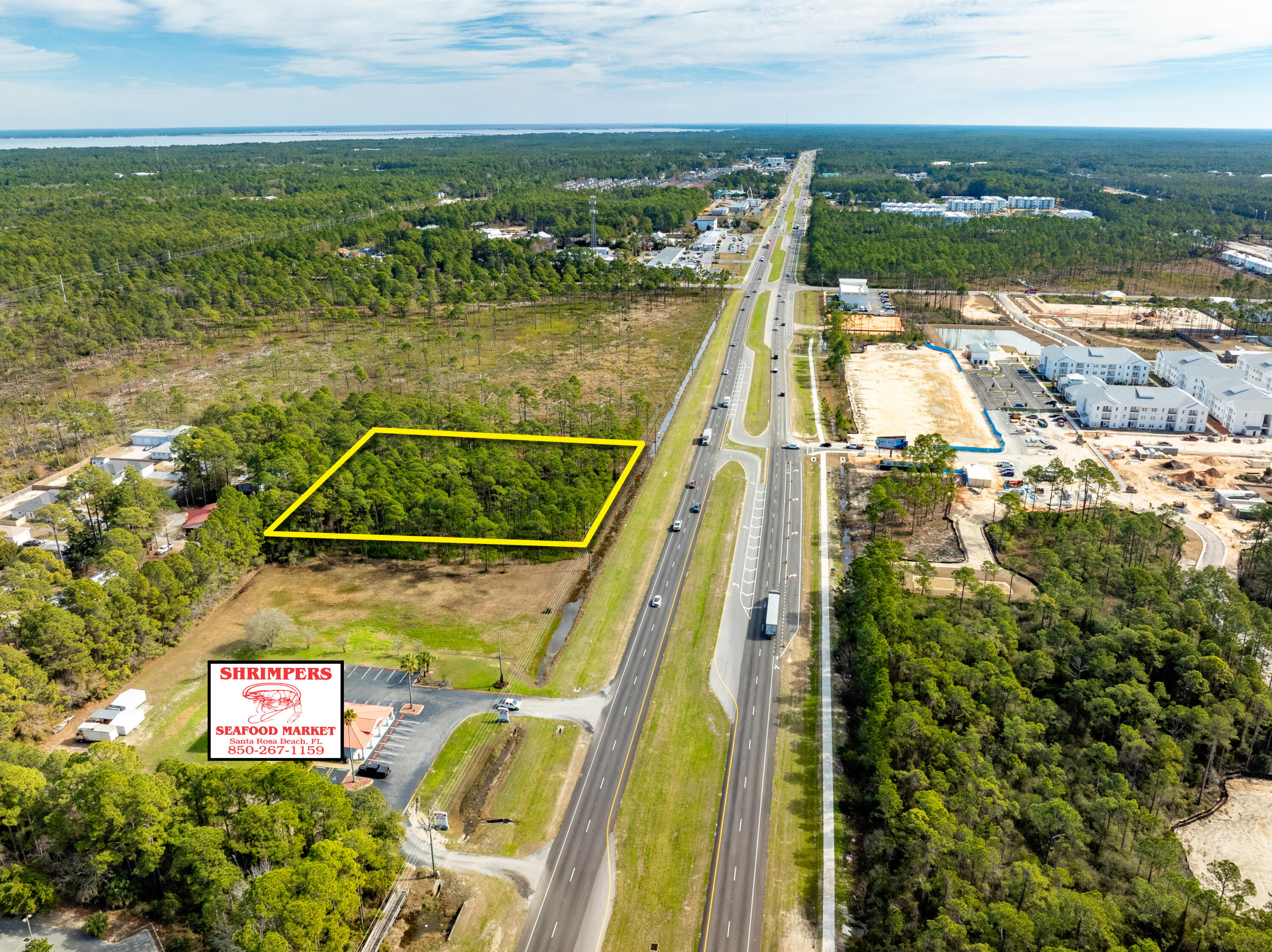 NEW LISTING of Prime Commercial Vacant Land in Santa Rosa Beach, Florida!
This ±2.118-acre site spans ±279' along Highway 98, adjacent to Shrimpers Seafood to the West, and adjacent to the East is ±145 acres of State Forest.  Zoned Village Mixed Use, this acreage offers a multitude of viable end-uses.  The current conceptual site plan illustrates a medical facility and a separate pharmacy building with a drive-thru.  The civil engineering for ingress and egress is superb, offering a deceleration lane and median cross-cut for the benefit of Eastward-bound traffic. Please inquire for further details.