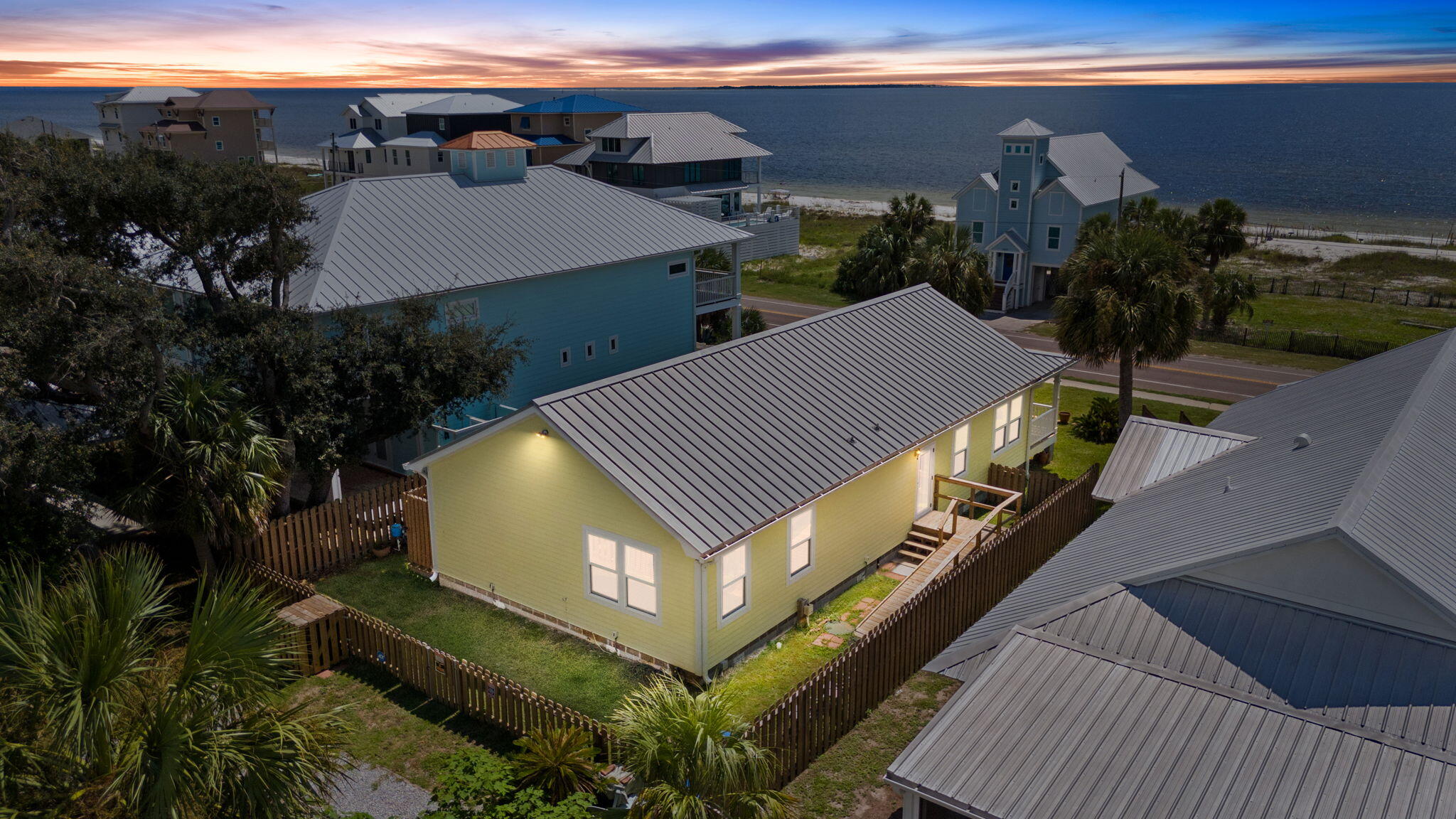 Beautiful 1st tier home across the street from the beach on an elevated lot in Beacon Hill. This home is very close to the beach access. This home is only 5 years old and is in great condition and has never used as a rental. There are many higher end finishes and great beach views with access along Hwy 98 as well as a quiet driveway with extra parking in the back of the house. Enjoy cortec flooring throughout, quartz countertops, standing seam metal roof, fenced yard, sewer and public water, outdoor shower, security system, sprinkler system and much more.