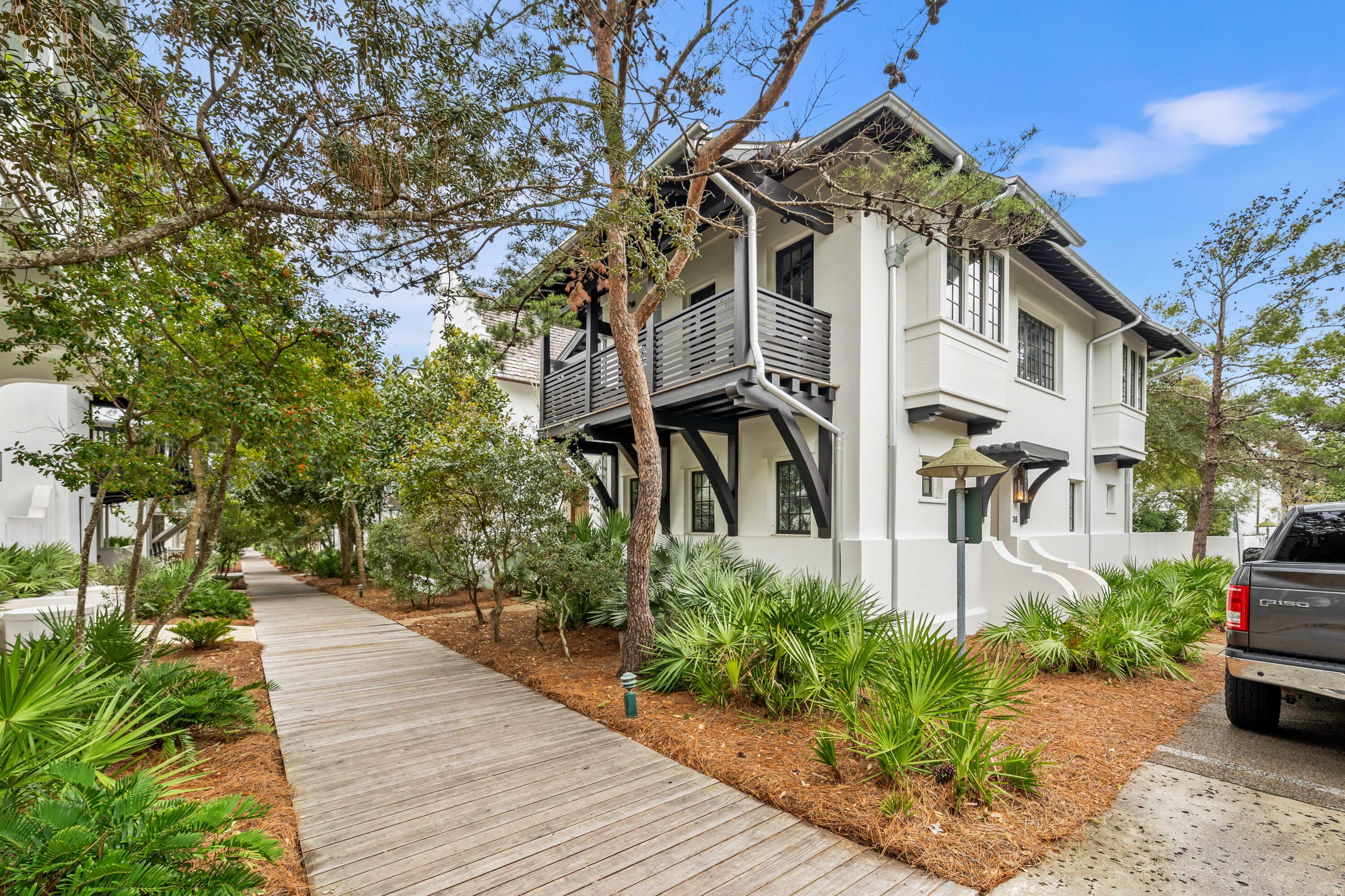 Major price reduction! Discover the ultimate beachside retreat in Rosemary Beach! Nestled perfectly south of 30A, this home is a stone's throw away from the charming town center and just around the corner from the Barbados pool. It's a beach lover's dream, with a boardwalk leading to the pristine white sandy beaches of the Gulf of Mexico.

This cozy abode features 3 full bedrooms (two are on the first level) and 3 full baths, providing ample space for relaxation and privacy. Step into your own oasis with a private courtyard, perfect for unwinding after a day in the sun. 

Upstairs, enjoy the wood beam cathedral ceiling that spans the kitchen, living, and dining areas, along with an expansive covered balcony, offering a serene spot to take in the coastal breeze.   MORE The heart of the home is the open and light-filled living space. Stained concrete floors on the first level create a cool and beachy atmosphere, while upstairs boasts elegant wood floors. The kitchen is a culinary haven, and the covered balcony off it is ideal for dining alfresco - a perfect setting for entertaining friends and family.
Parking is a breeze with the convenience of a carport, and the open entertaining area above adds a touch of coastal charm. Embrace the beach lifestyle in this meticulously placed home that captures the essence of coastal living without compromise. Don't miss the chance to make this Rosemary Beach retreat your own! Please verify any information, including but not limited to square footage, that may be important to you.