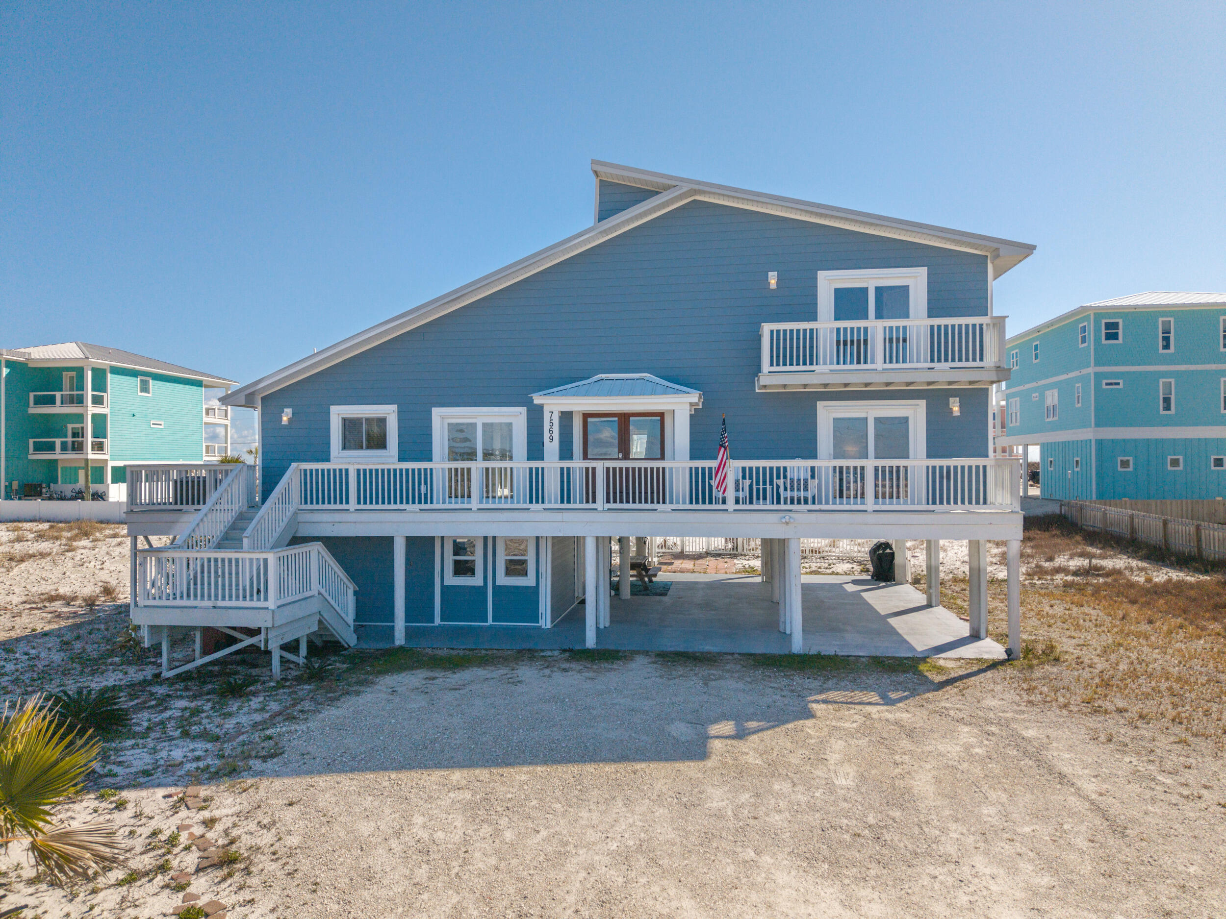 Welcome to 7569 White Sands Blvd, an updated single-family home on Navare Beach with gorgeous unobstructed views of the Santa Rosa Sound and of the Gulf of Mexico. Featuring 4 bedrooms and 2 bathrooms, this beach house is an excellent choice for those seeking a profitable investment opportunity or a personal retreat to enjoy beautiful views of the Gulf and Sound with easy beach access. This property has proven the test of time and is turn key, while offering endless potential on a large lot with no HOA.

Inside you'll notice the sweeping water views through light filled windows, a vaulted tongue and groove ceiling, a floor to ceiling stone fireplace and thoughtful design elements including arched doorways. The spacious living area is open to a well appointed kitchen and adjacent to a dining room, perfect for family dinners or game night. Two bedrooms and one bath are located on the lower living level - one with a king bed and one with two queens overlooking the Sound. Upstairs you will find two bedrooms with private balconies - one Gulf view and the other Sound view - separated by a shared bathroom and storage area/ closet.

Outdoor living is a delight with the home's muliple decks, providing the perfect space to enjoy your morning coffee and evening sunsets. Parking is ample underneath the house and along the driveway, with additional RV parking  and hookup on side. The large ground floor storage area is able to hold bikes, a golf cart and all the beach toys - plus this space currently has plumbing and electricity, making it a perfect opportunity to be transformed into additional living space or a lock-out unit. The large yard not only gives you nice room between your neighbors, but is a blank slate for a future pool oasis.

All of the special features of this home are topped off with a newer metal roof with paid off SOLAR PANELS, so you can have peace of mind about low electric bills. 

This home is an amazing buy on Navarre Beach. Don't miss this opportunity to own a beach home that combines practical features, stunning views and a relaxing environment. Schedule your private showing today and discover all that 7569 White Sands Blvd has to offer!