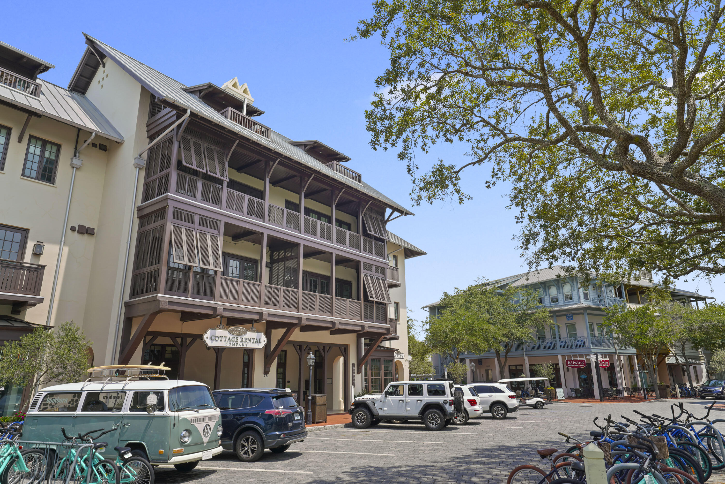 Style meets comfort in this casually sophisticated 3rd-floor condo in the heart of Rosemary Beach Town Center.  This gem offers a spacious balcony that spans the entire width of the condo, giving you a front-row seat to the charming views of Barrett Square. Inside, you'll find hardwood floors throughout, a kitchen adorned with  soft blue cabinets, and high-end Viking appliances set against sleek quartz countertops. The entryway features beautiful wood beams, leading you into a separate dining area and an open living space with built-ins and a flat-screen TV.

The layout is thoughtfully designed with the primary suite on the eastern side, complete with a large en-suite bath, and a guest room on the western end, also with its own private bath. A cozy bunk room near the primary suite adds a third sleeping area, perfect for visitors or a quiet retreat. 
Living here means the convenience of enjoying local restaurants, shops, and coffee spotsall visible from your balcony. And when you're ready to soak up the sun, just head south from your building, and you'll find yourself right at the beach! This condo truly offers the best of coastal living.