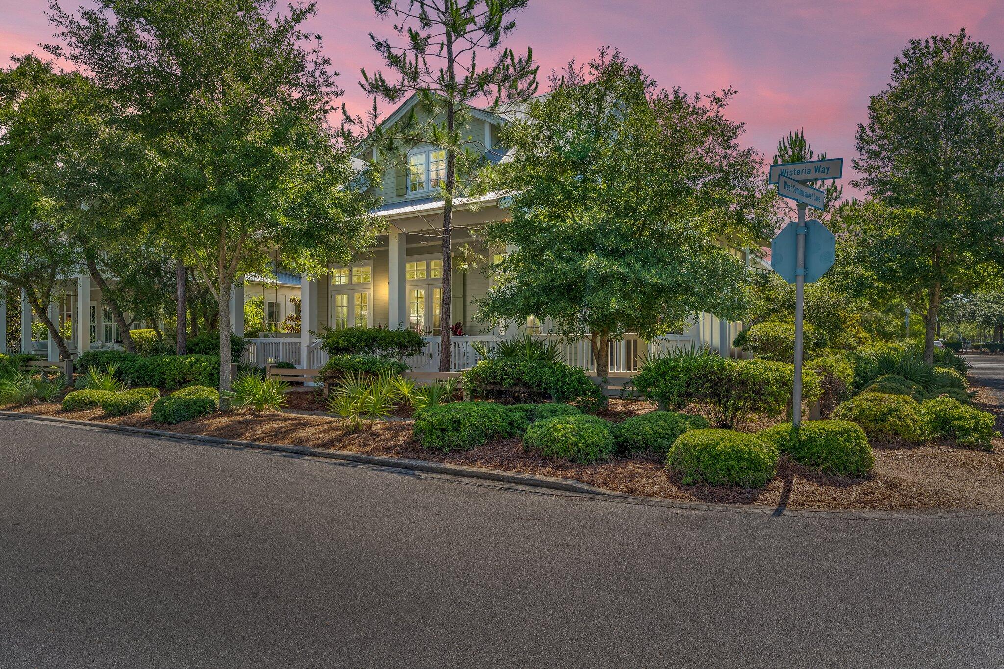 Let us harken back to the good old days where front porch sitting was the choice leisure activity, when families and friends gathered in cheerful conversation as passersby waved in good spirit. Rediscover this Southern charm and hospitality at it's finest in one of the premiere communities along 30A, WaterColor! The appropriately named Magnolia plan, a finely constructed Romair home in Phase 4 is an absolute gem! One may say a true rarity having never been a rental, but rather a second home lightly lived in by only 2 families! This brilliant residence rests on a corner lot, with a full size detached garage, 4 additional parking spots, and even comes with approved transferable pool plans & professional landscape design! The location of this home is superb allowing for quick easy access to both HWY 395 and HWY 30A! You'll love bringing everyone together in the heart of the home in the open concept bright white living, dining and kitchen area with stunning 12ft ceilings that become a focal point of the space. The kitchen is well defined by a large marble island, with wine cooler & icemaker, beautiful Coastal Living cabinetry with easy glide drawers/doors, Wolf appliances, and easy access to a bonus screened in porch with a TV perfect for grilling and watching all your favorite sports! The master suite is on the main level with private 4 piece bath and walk-in closet. A full separate laundry room complete with cabinetry and sink along with a day bed area and powder bath occupy the lower level. The secondary floor has two additional bedrooms each with a full bathroom, and in the middle a 4 bed bunk area. There's an additional den or second living room space with powder bath perfect to host a lively group in one place. This home is a fantastic option and features some incredible flexibility for long-term living or as a rental investment/second home. Explore a wealth of amenities from lagoon like resort style pools, pathways for walking, serene water features, biking/walking paths, kayaking, dining and much more to explore. The wonder of WaterColor awaits!