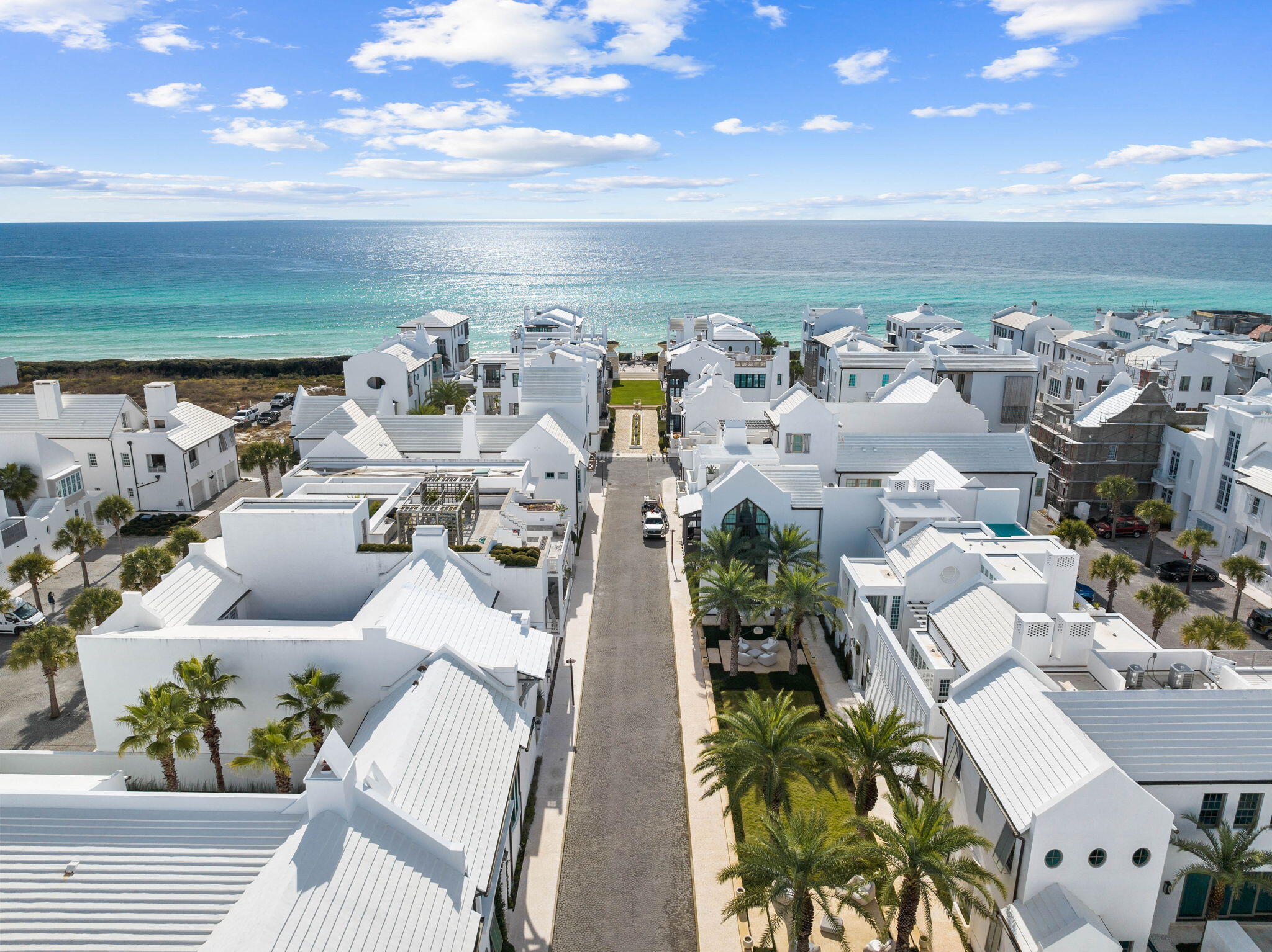 Located south of 30-A, this prime Alys Beach location on South Charles Street offers easy access to the Beach Club and Gulf Green. Designed by Dunham Architecture and Urban Design, this welcoming courtyard home offers 4 bedrooms with 4 full bath and 2 half-bath. This never rented residence has been carefully maintained and comes professionally furnished. This premium 40' wide x 80' deep lot offers ample space and design advantages.
A spacious front loggia with dramatic signature arch greets you and your guests. Numerous builder upgrades include venetian plastered walls and ceilings, coral shell stone and white oak wide plank flooring. Clean crisp lines with a natural color palette of whites, creams and beiges frame a most comfortable floor plan in this exclusive 30-A beach community. The fully equipped Miele kitchen suite allows ease of use for the gourmet cook while providing an abundance of storage cabinetry and ample pantry. A six burner cooktop with griddle and double oven is accompanied by Miele's refrigerator, freezer, 84 bottle full height wine cooler, dishwasher, warming drawer and built-in coffee machine. Caesarstone countertops with waterfall island, custom Grimes cabinetry in a classic Grey stain with Schuab hardware and Versailles glass backsplash complete your culinary experience. 
The open living and conversation area features an ample seating area, gas fireplace and built in display shelving. Open the double doors to hear the soothing pool fountains.
Ceilings of twelve feet are accompanied by eight foot interior doors that feature an upgraded horizontal oak plank stain with Ashley Norton hardware. Bedrooms feature ensuite bathrooms with Carrara marble countertops, flooring and shower tile with a diamond inlay.
The first floor king bedroom suite opens onto a spacious covered loggia, courtyard and the pool. A practical fourth bedroom with bath and private entry for your guests is easily accessible from the rear Zaguan. An outdoor shower and summer kitchen with 36" Wolf grill & overhead exhaust system are also conveniently located off the Zaguan. Waterline tile and fountain spouts frame the tranquil courtyard pool.  
Arriving to the second level, find a spacious Family & TV Room with vaulted wood ceiling in a beautiful white wash finish with venetian plaster walls. Balcony doors open onto the large 2nd floor outdoor covered loggia area that serves as a third living area. Outdoor appliances by Perlick include an ice machine, beverage center and wine cooler. All are framed by NatureKast outdoor cabinetry in a TeakKast fossil grey. Watch a ball game or enjoy the fireplace with family on the enchanting terrace that overlooks the pool as well as the grand palms of Palmera Park. Even catch a corner view of the gulf!
An interior and exterior gallery connects to the primary king suite with 14 foot vaulted beam ceiling, dual closets and large ensuite bath. Bedroom three also features a vaulted beam ceiling and king bedding.   
Completing your home experience is Control4, iPad house system interface, home water sensor system and two reserved parking spaces.