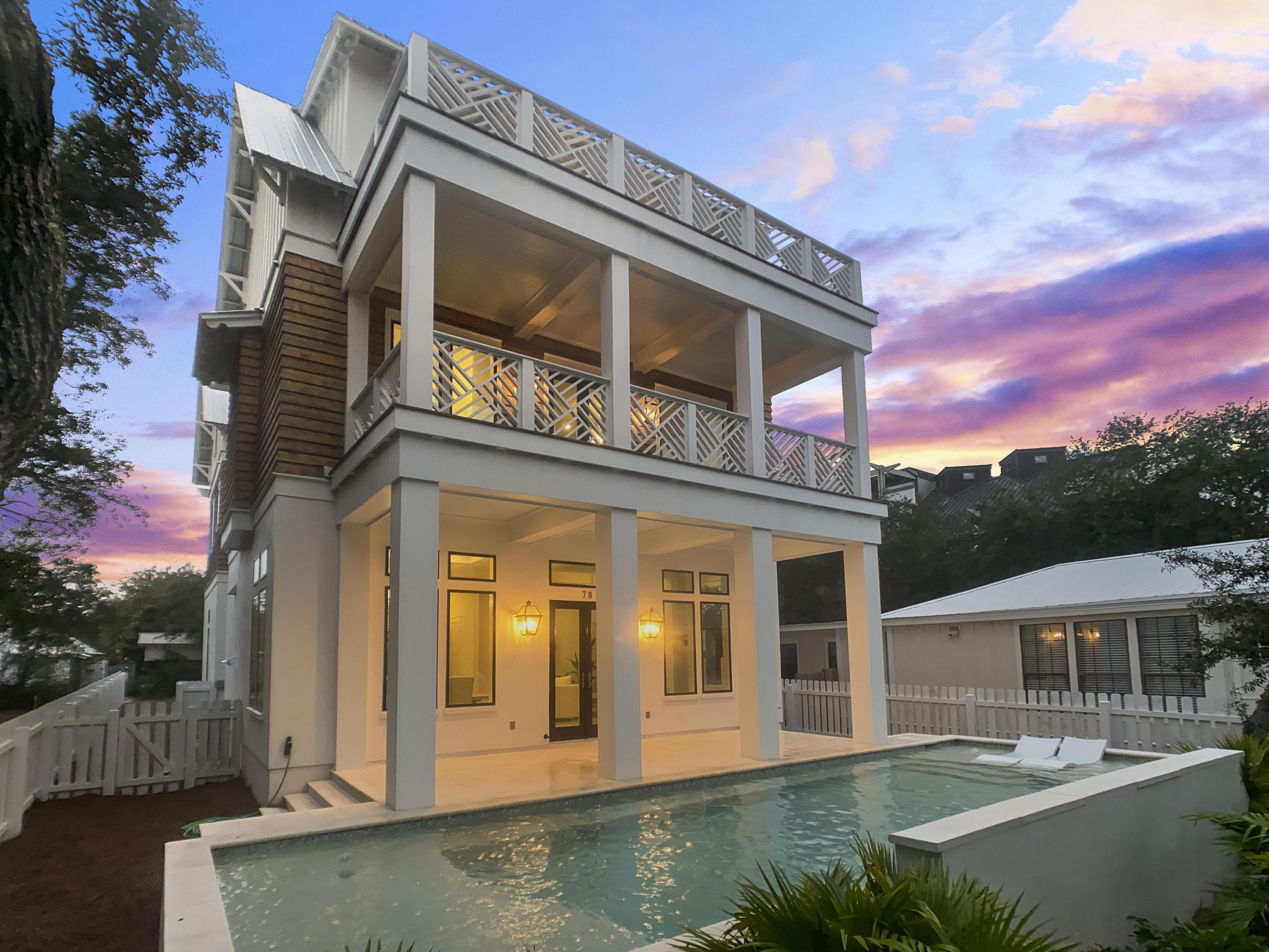For those who are seeking the ultimate in location, luxury and living: Welcome to the 78 Banfill Street. Situated in beautiful Grayton Beach, where vacationing first began, this newly constructed beach estate exudes sophistication, casual elegance and charm. Totaling 4,800 square feet with 6 bedrooms and 5.5 bathrooms, this family compound is perfectly fit to suit those looking for privacy and space. Live and entertain in total luxury in the open and light great room adjoining the state-of-the-art chef's kitchen, complete with a suite of Wolf & Subzero appliances complimenting the marble countertops & custom cabinetry. Relax around your gas fireplace with family or bask in the sun on your private patio area and oversized heated pool, creating a space practically designed with entertaining in mind. 
Notable features include: Two car Garage, elevator, Third Floor Master Suite, bunk room, Mahogany front door, marble backsplash, 2 -1/4" solid interior doors, hardwood floors, wet bar, impact doors & windows, designer Emtek door hardware throughout, exterior copper lanterns, swimming pool. 
Life at Grayton Beach means laidback beach lifestyle: Enjoy a drink or a meal at Chiringo's with beautiful Gulf views, explore the trails at Grayton Beach State Park, work out at Grayton Fitness and enjoy the live music at AJ's. Minutes from Seaside and a short drive to Rosemary Beach, you'll appreciate the location of this unconventionally colorful beach town.