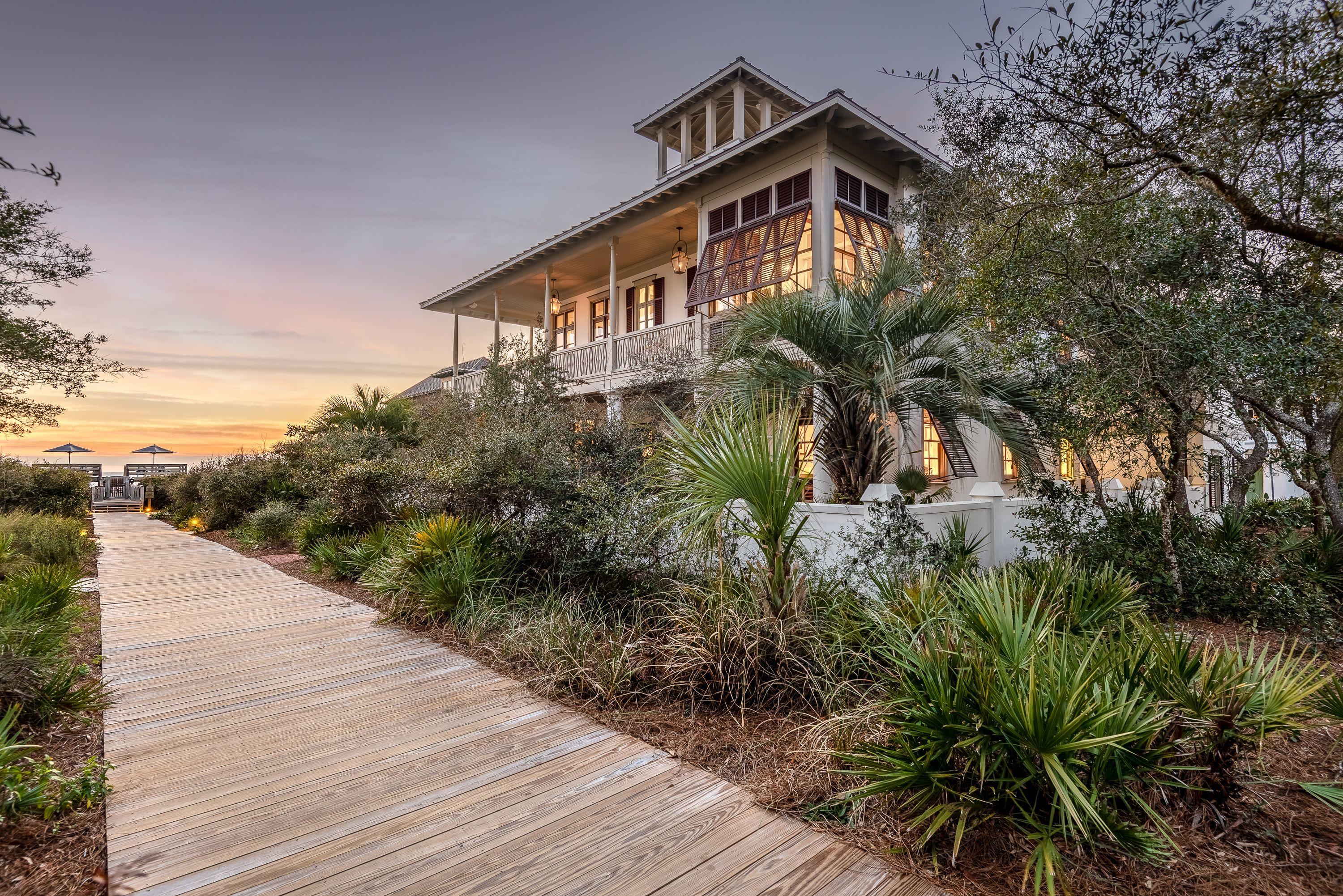 Situated just one home off the Gulf along quiet Boardwalk D in Rosemary Beach, this Southern-style beach cottage offers picturesque Gulf views. Quality construction by Ficarra Builders, the Main House, Carriage House, and courtyard with private pool sit on one of the larger lots in Rosemary Beach. Spacious, covered balconies face the Gulf on both the first and second levels, with an outdoor fireplace on the upstairs porch, and the top floor covered tower offers panoramic Gulf views. With solid Mahogany doors, custom Marvin windows, hand-turned interior and exterior wood, and wrap around balconies make this a timeless Rosemary Beach home.
