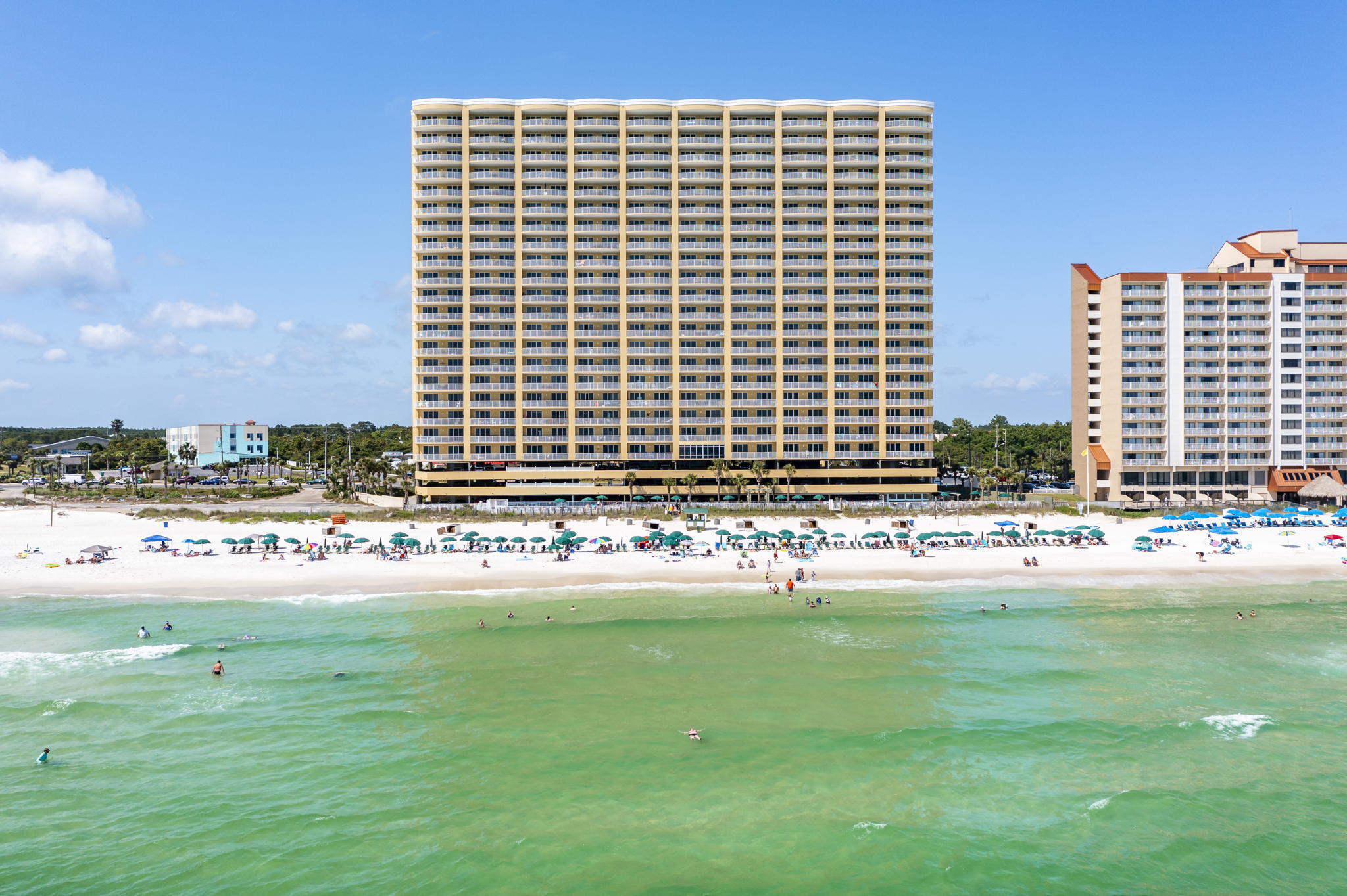 UNDER CONTRACT, TAKING BACK UP OFFERS. This never-rented coveted end unit condo with the most amazing wide-open balconies is ready for you. Emerald Isle is located west of Pier Park 15 minutes away from the airport and has easy access to Rosemary Beach to the east. People enjoy this building because it is in the more quiet part of the beach yet close to great shopping and restaurants. There is a great swimming pool, tennis courts and fitness center and these units boast ample living spaces with panoramic views.
