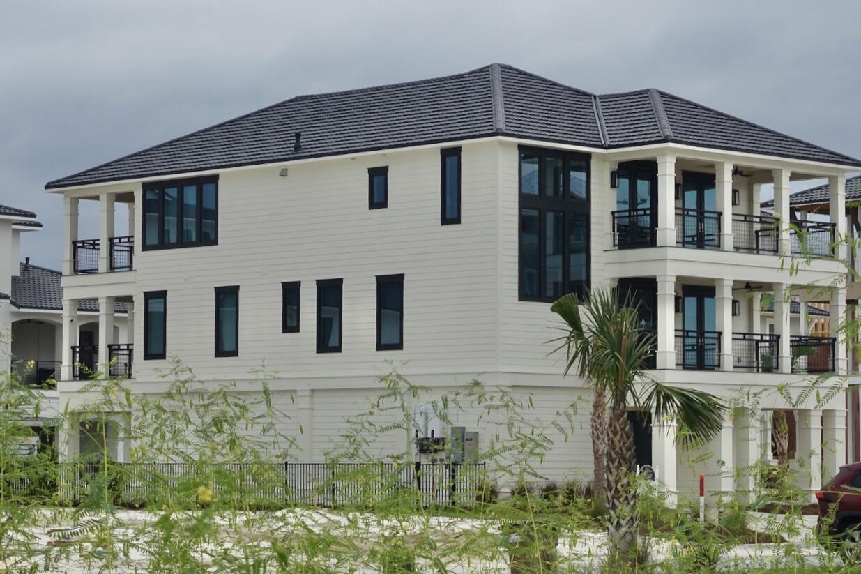 OPEN HOUSE 12-3pm, SUNDAY, May 24th, 2026. TEXT or CALL William 850-428-2424 for Gate Access. Discover an exquisite home situated on the coveted Sugar Sand Beach within Mexico Beach's exclusive Gated Coastal Community. This unique enclave comprises just 99 homesites, distinguished by its pristine natural surroundings, including protected Nature Preserves and a secluded Private Beach, offering an escape from the crowds. Residents enjoy access to a meticulously designed Community Pool & Pool House, ideal for picturesque entertaining with expansive indoor/outdoor spaces, gourmet kitchen & well-equipped gym. This impeccably furnished residence, located at 124 Sugar Sand West, on the sought after west side of the community, boasts attractive curb appeal with tasteful landscaping, ample parking in the beautifully finished garage & a spacious driveway. An elevator provides convenient access to the 3rd floor, where a Grand Living Room & elegant Kitchen await. The stunning Kitchen features high-end Thermador gourmet appliances, a magnificent Island, an adjacent overflow area complete with additional built-in storage, crushed ice maker & an espresso coffee maker. A spacious balcony extends the entertaining possibilities, offering splendid views and a refreshing Gulf breeze. The 2nd floor hosts comfortable living areas with 9ft ceilings. A luxurious Master Suite, with private balcony, is thoughtfully designed with an opulent bathroom & custom walk-in closet. Four guest bedrooms, two and a half bathrooms & a well-appointed laundry room. 4 sizable balconies, each featuring composite decking & cypress ceilings, provide a variety of scenic views. Rear balconies offer glimpses of the Gulf over acres of untouched dunes, while the front balconies provide vistas across the preserved areas that encircle this breathtaking community. Property is in the Preferred X-Zone. The home has never been rented but Gross Rental Income Projection was $125,000 to $150,000. Don't miss this fabulous home!