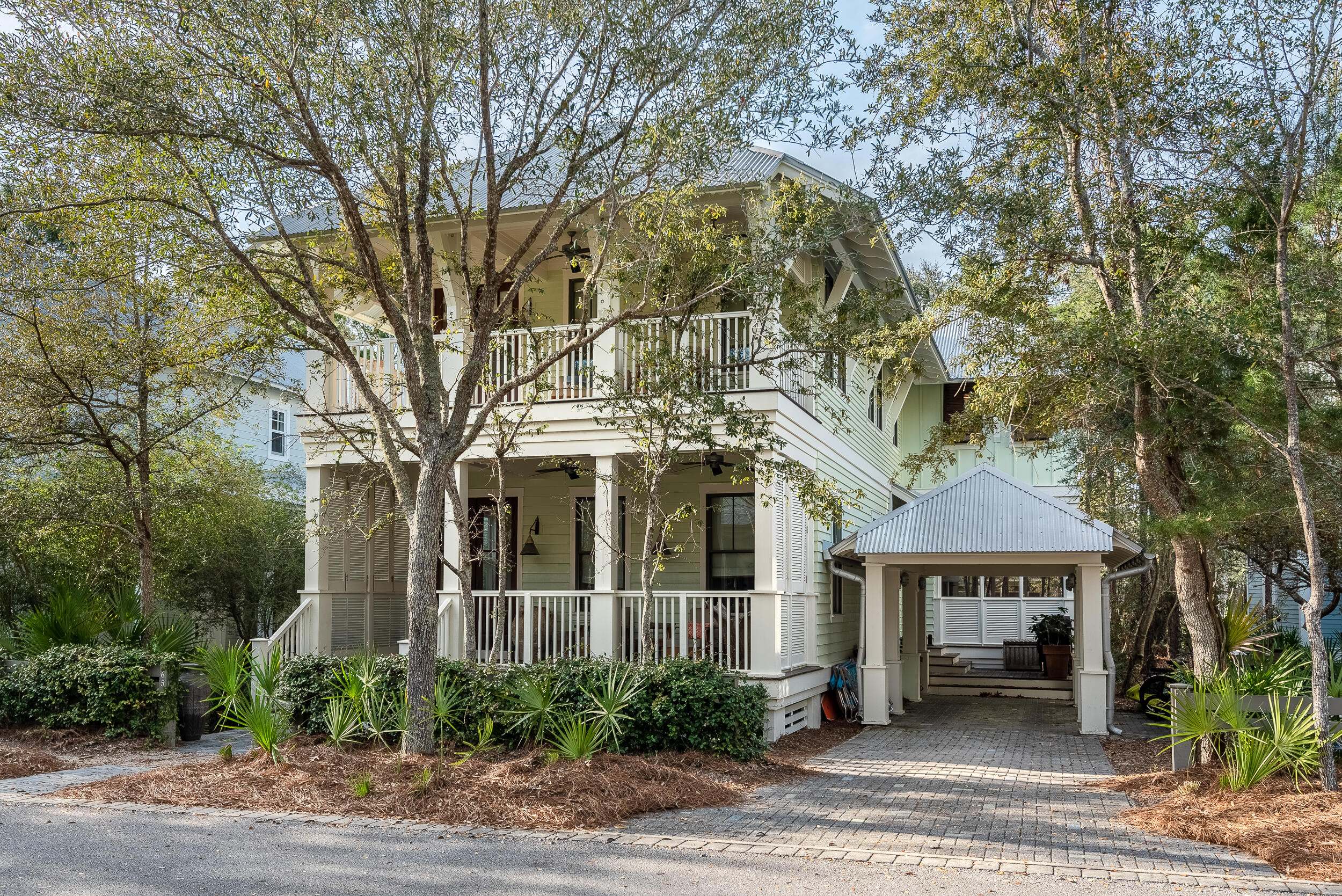 This Stunning, turn-key WaterColor home is prominently located in one of the most desirable locations of Phase II, situated graciously on the green of Camp WaterColor backed by a serene pond and Wood Fern Park. As you enter the home you are greeted with beautiful hardwood floors, high ceilings, shiplap walls and custom interior finishes throughout making a true craftsman. The open-concept floor plan is an ideal entertainment space with a chef's kitchen with top of the line stainless appliances, offering a large center island with a prep sink, butler's pantry, wine refrigerator and ample dining space. There is one spacious bedroom on the main level and a beautiful master suite with double vanities and a private balcony. Additional guest rooms are located on the second level, one with built bunk beds that sleeps four. All bedrooms have their own full bathroom as well as access to additional outside balconies. This home has a floor plan that works perfectly as a full time residence, second or investment home, and is conveniently located within steps of Camp Watercolor! Watercolor offers walking and biking trails and the pedestrian bridge over western lake offers beach access via bike in just minutes. This home is truly a masterpiece built in 2007 in the coveted Watercolor Community.