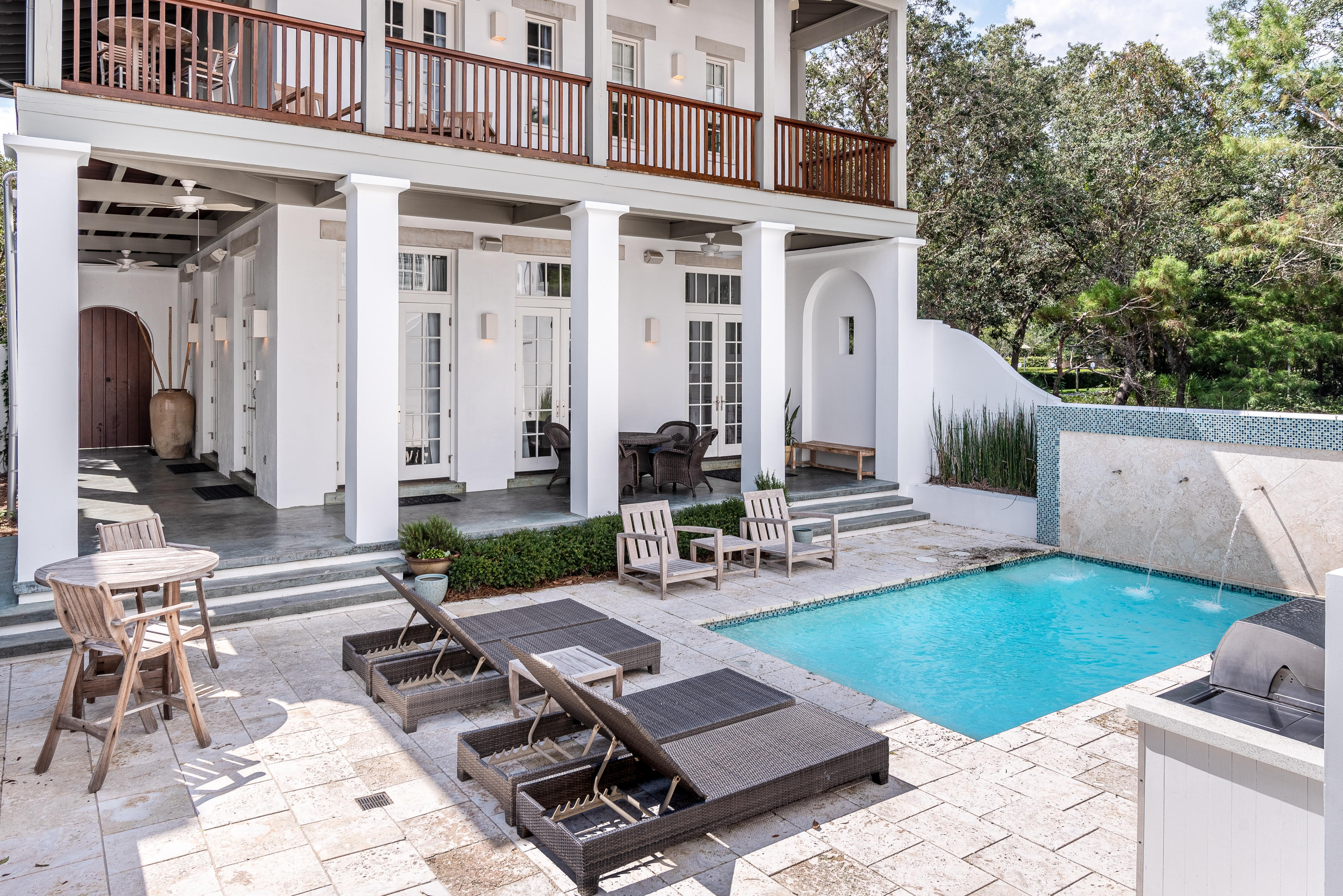 Located on the south side of 30A in Rosemary Beach you will find this concrete constructed home positioned on an oversized private lot. Great for entertaining, this home boasts an incredible outdoor courtyard. Entering the courtyard from the boardwalk through the large mahogany double door, you will find the epitome of outdoor entertainment within the covered oversized wrap-around verandas, exclusive courtyard with a private pool that includes water features, and a Summer Kitchen for outdoor grilling. 

Entering the home through the french doors you will be greeted by a first-floor kitchen, living space, and dining room. Tastefully renovated, the interior of the main home features shiplap walls throughout, Brazilian Cherry Hardwood floors, stunning fireplace with copper accents, and 4 spacious bedrooms + a bonus area.  

Located within walking distance to The Square, there's no shortage of entertainment with all of the restaurants, shopping, and events Rosemary Beach has to offer just steps away. Walk down the boardwalk to the beach, pass by the Coquina pool, and through the Eastern Green. 

This home also features a separate detached two-level carriage house. Located across the courtyard, there is separate access to the carriage house to maximize guest privacy. Found inside the carriage house on the entry-level are an open floor plan living and dining area, full kitchen, bunk room, and a half bath. Follow the staircase to revel the second-floor master bedroom with an ensuite bathroom.