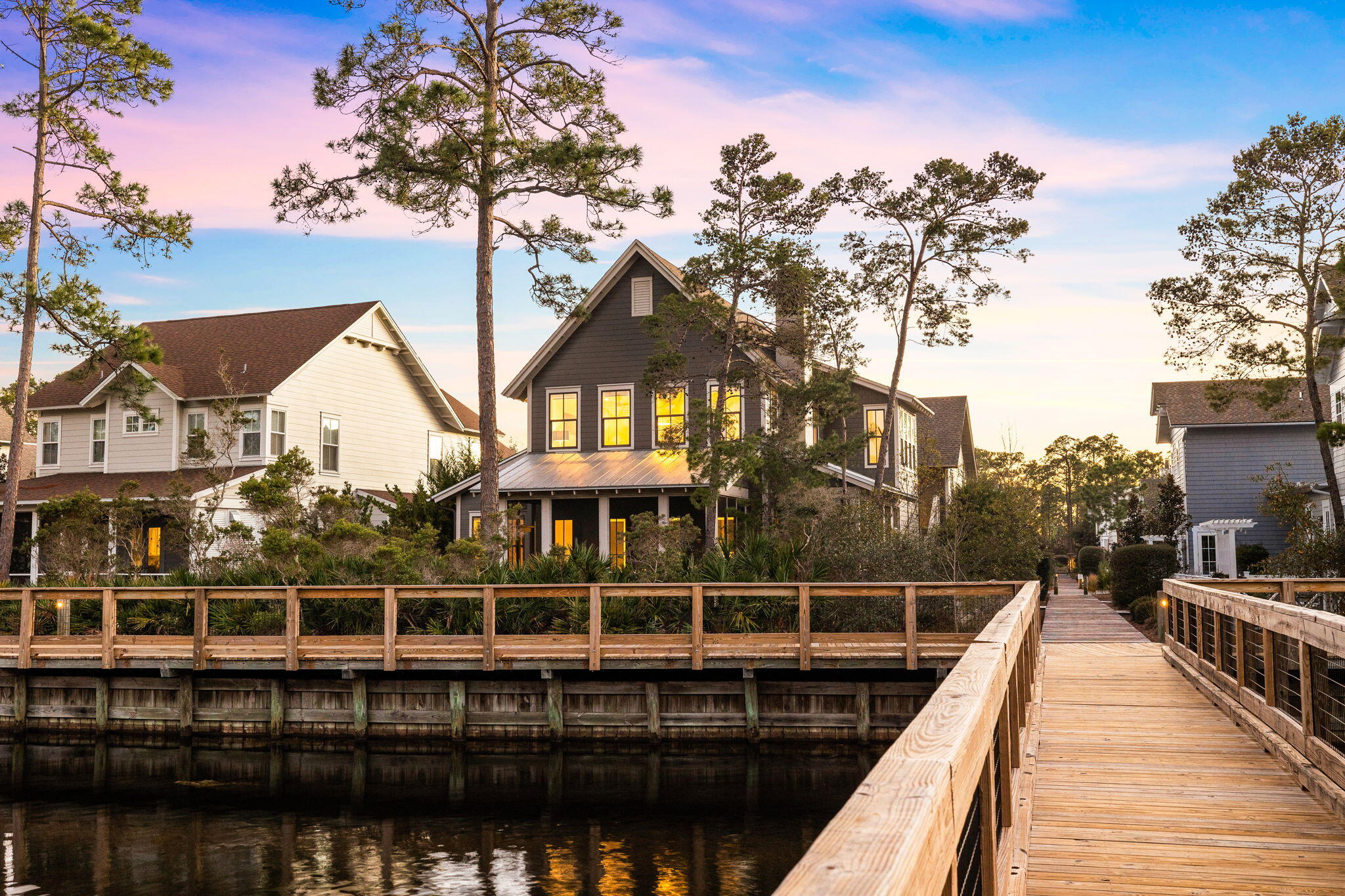 Situated in an exclusive gated community, (the best kept secret along 30A), 295 Plimsoll Way offers premier access to the lifestyle and amenities of the Watersound West neighborhood. Positioned on the community's lake and within a 5 minute walk to the private beach walk-over as well as the community pool; this property provides an unparalleled approach to the natural resources, sugar white sands and emerald waters of 30A's coastal beaches. Siituated alongside the state park and boasting a private beach for the neighborhood residents, the access to the emerald waters is one of the most unique on 30A. 
 
The contemporary design features an expansive and open living space that seamlessly connects the kitchen, dining area, and living room. The Chef's kitchen showcases and oversized island and premier appliances. Step outside and an outdoor living area highlighted by a relaxing screened-in porch and soothing fire feature. This area leaves plenty of space for the addition of a pool if a future homeowner desires. The opulent primary suite, found on the main level, presents an extravagant bathroom adorned with a double vanity, a custom-tiled shower, complete with a spacious walk-in closet. A powder bath and laundry room with two washer/dryer sets complete the main level. Up the stairs, you will find three additional bedrooms, complete with two full baths as well as an additional sitting area. Views of the water are enjoyed in numerous rooms on this level. Custom tile flooring is situated throughout the house which is a dream to maintain at the beach. In he attic, there has been framing laid out to allow for the addition of a spiral staircase to a top floor loft/lounge. This would add an additional 500sq ft to the home for a future owner.

Access to the carriage house is available both from the upper level and below. The studio floor plan features a cathedral ceiling, full bath, living space, and kitchenette. It is perfect for guests, in laws, as an added bedroom or for a work from home office suite.

Watersound West Beach is located in the highly sought after east end of 30A. Amenities include a large resort pool, walking trails and deeded beach access. While this home was built as a primary residence and has not weathered heavy rental seasons, it does offer tremendous potential for rental income. 295 Plimsoll Way would make the perfect investment property, second home or primary residence."