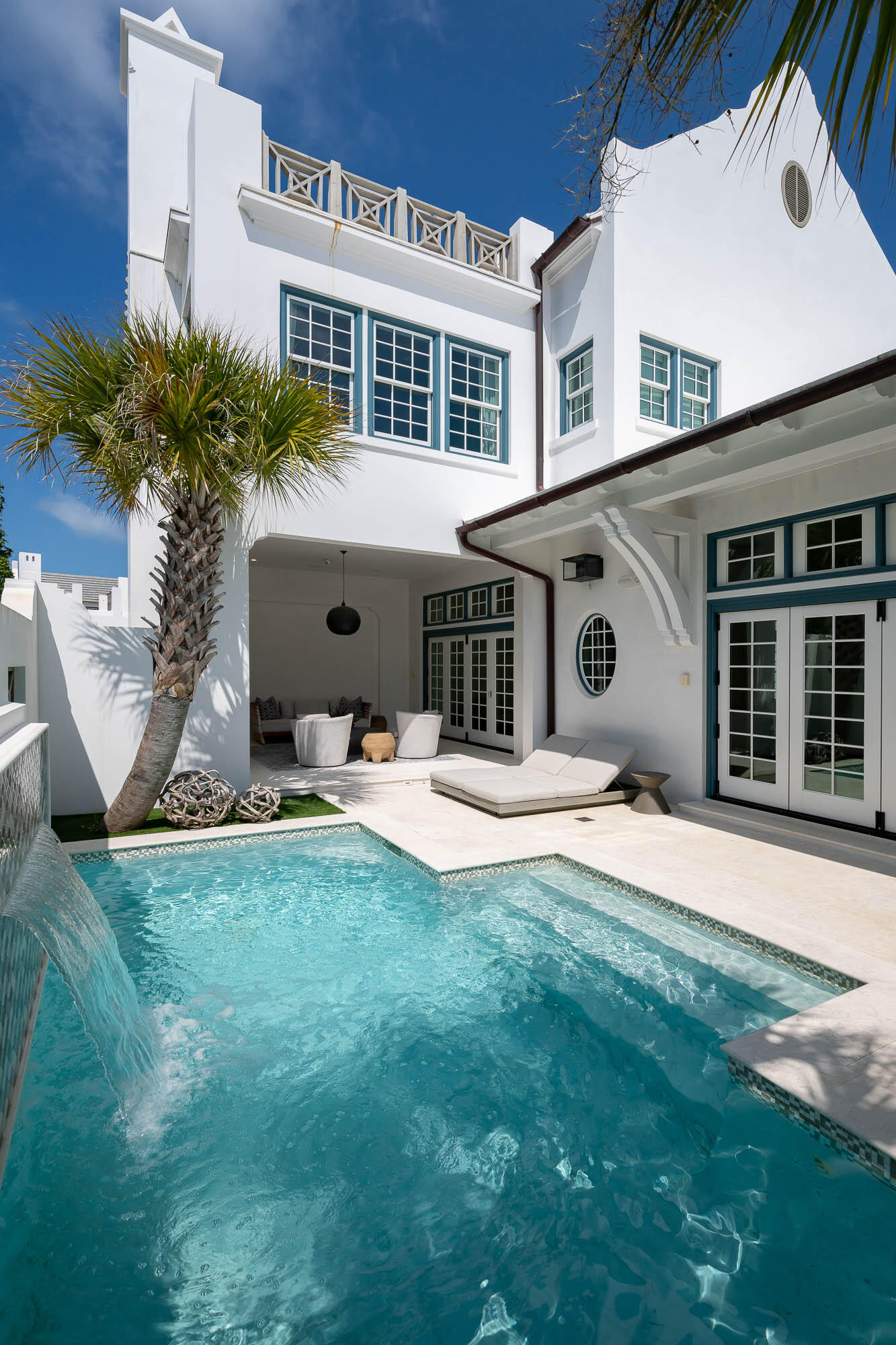 Location and great design define 73 Whalebone Alley in Alys Beach. A large third floor rooftop terrace is perfectly positioned looking down the entirety of  Turtle Bale Pedestrian Path to its final completion at the Gulf of Mexico. This freestanding home sits on a large 50'x100' homesite which architect, T.S. Adams Studio, used to maximize generous first floor living and outdoor spaces to give the feel of a private resort. 

From the venetian plaster to the custom tile selections, upgraded finishes and appliances are found throughout the 3,831 square feet. Upon entry from Turtle Bale Park, a large foyer grants a proper welcome to the house. The kitchen, living, and dining areas open to the oversized courtyard/pool area and covered loggia through two sets of bi-folding door systems. An outdoor grilling area and pool bath are at the back of the courtyard alongside the large two car garage with enough ceiling height to allow for a car lift if desired. A junior master suite rounds out the first floor with three additional bedrooms on the second floor. A third floor wet bar area leads out to the expansive rooftop terrace with firepit and panoramic views of Alys Beach.