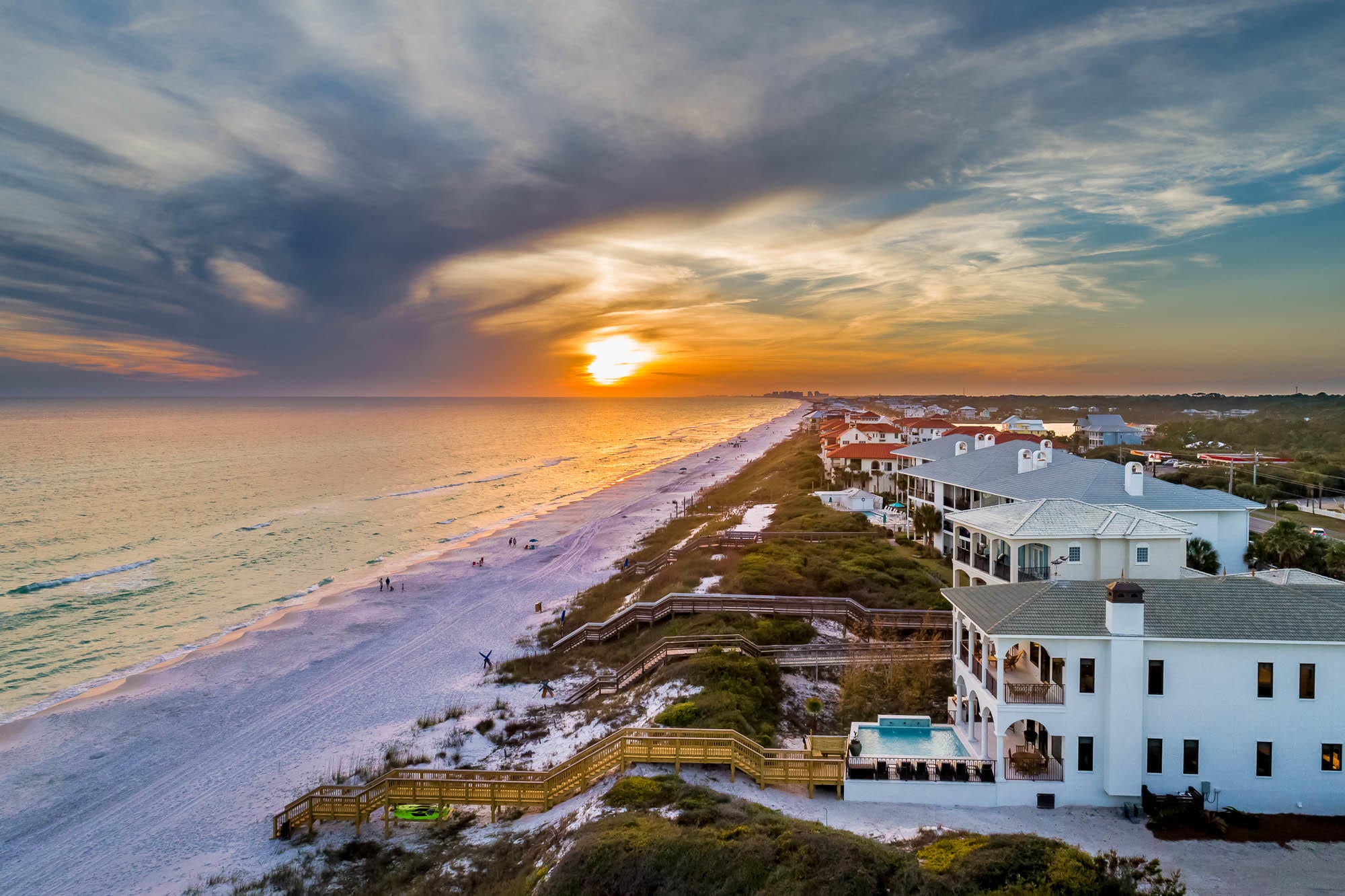 Experience luxury Gulf front living on 30A. Towering over the Gulf of Mexico, breathtaking views from every room await! Stunning architecture and spacious design characterize this private beachside retreat. Features of this astonishing home include a lavish Gulf side pool, private beach walk-over, a well-equipped summer kitchen, a state-of-the-art home theater, designer interiors and luxury finishes. This fully renovated 5,743 square foot home offers a jaw-dropping master suite, 3 king junior suites, one queen suite, two bunk rooms, and 6.5 bathrooms; comfortably sleeping 24. The property boasts an enormous great room overlooking the Gulf of Mexico featuring a chef's kitchen, custom shuffle board table, dining for the entire family, wet bar, and a spacious living area centered around a grand fireplace. The massive private theater is situated off the great room and offers theater seating, incredible surround sound, programable lighting, a large wine cooler and a well-equipped wet bar. Additionally on the first level, you will find a beautiful junior king suite boasting a lavish master bath with free-standing soaking tub.

The large private master suite is located on the second floor and offers incredible views of the Gulf from the enormous bedroom, exquisite bathroom and private porch. The spacious master bathroom offers an additional freestanding tub and massive walk-in shower! Additionally, on the second floor you will find the next junior suite, two bunk rooms and an additional bathroom.

The secluded carriage house provides a private space away from the main house and contains a separate kitchen, living space, bedroom and bathroom. Additional amenities include a grand foyer, built-in bunks, two-car garage, ample parking, all the necessary AV wiring, a geothermal HVAC system and a large utility room with double washing machines and dryers. All furnishings with the exception of personal art convey with the property. 

Located in Dune Allen, this property is conveniently located close to everything 30A has to offer including first-class shopping, luxury dining and world-class fishing. Do not miss the opportunity to experience Gulf front luxury living at its finest. Buyer to verify all dimensions.