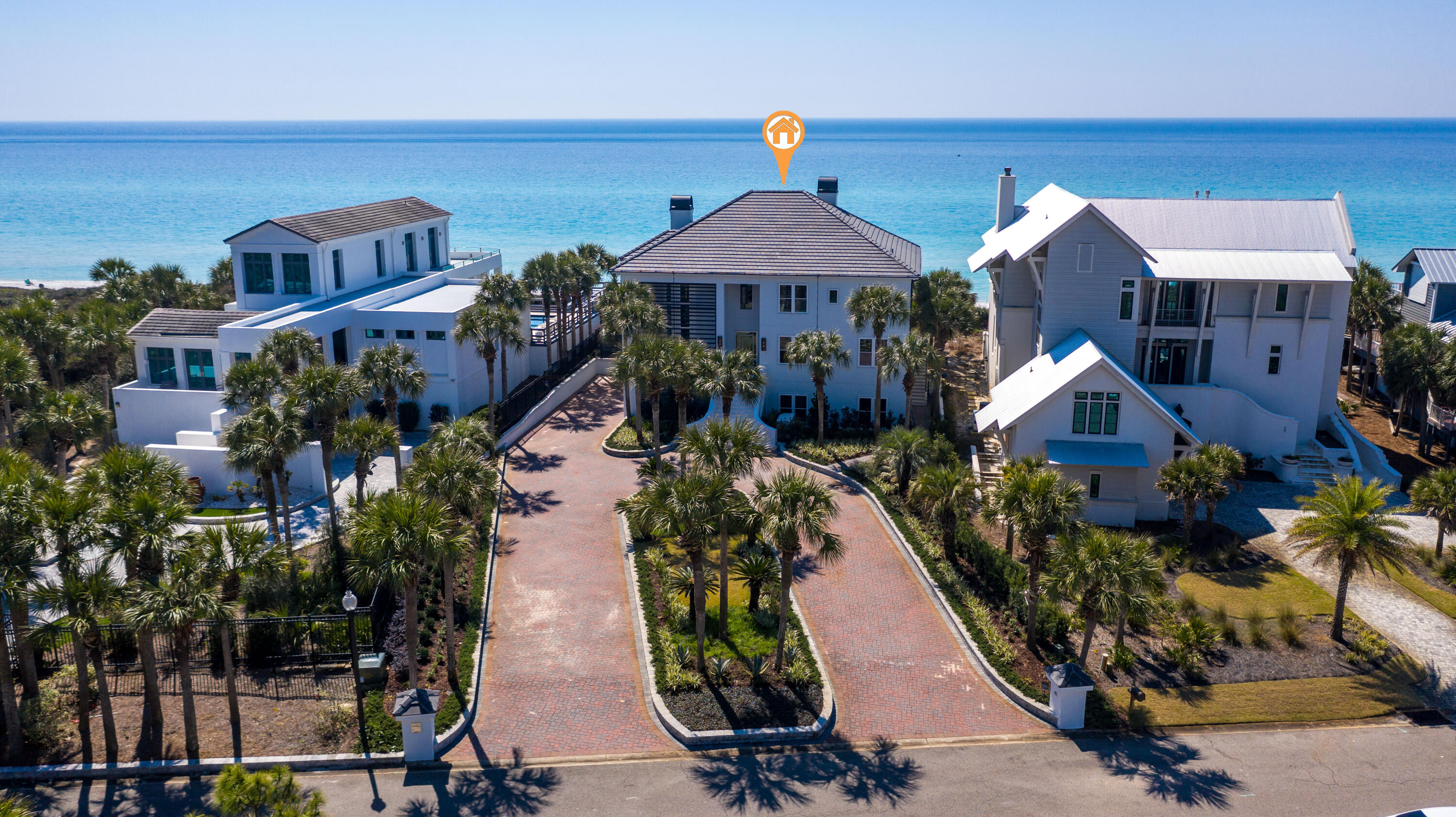 This remarkable Gulf front home tucked away in the exclusive gated Gulf Dunes subdivision of 30A is sure to impress! This 4-bedroom home boasts ~5,600 sq ft and is situated on an estate sized lot with 85 ft of Gulf frontage and great outdoor areas, including the elevated Gulf front pool and green space. Exquisite interior design by Joey LaSalle of J LaSalle Designs and attention to detail is evident with beautiful architectural lines, custom lighting, and stunning finishes throughout the home with top-of-the-line brands such as Hansgrohe, Brizo, Kohler, Sub-Zero, and Thermador. This home is being offered fully furnished including the amazing artwork by local artists Ana Simpson, Brendan Parker, and Jonah Allen. This home has gorgeous curb appeal with all new landscaping and a circular paver driveway with parking space for 6. The ground level encompasses a 2-car garage, spacious entertainment area, and a guest suite. The entertainment space features a wet bar with wine storage, shuffleboard table, and a home theater system with Polk audio to elevate your favorite movies, TV shows, sports games, music, and more. The guest suite offers custom floating bunks with an ensuite bathroom and convenient laundry room. There is an elevator that services all three levels of the home or you can take the beautiful stairs with contemporary cable railing to the upper levels. 

A lovely, glass pivot door welcomes you into the foyer on the first floor. The captivating living area is lined with Gulf views and offers direct access to the covered pool deck. Ample natural light abounds with 10 ft ceilings and 8 ft high glass sliders throughout the home. There is a fantastic open office concept with banquette seating and tufted accent wall that makes working from home a pleasure. The first floor features 2 Gulf front guest suites, each with their own private bathroom and direct access to the covered pool deck. The guest suite to the east features an amazing ensuite bathroom offering a double vanity with Quartz countertop and custom cabinetry, walk-in closet with custom lighting, and a spa-worthy wet room with walk-in tile shower featuring dual shower heads, a third rainfall option, and a garden tub to unwind in. There is also a half bath located just off the living area for convenience. Capture breathtaking Gulf views from the large windows and 8 ft glass sliders that line the first floor and open to the covered deck with an elevated pool and hot tub. There is also an open deck perched above the beautiful, natural dunes with a private boardwalk to the beach. This expansive deck offers plenty of comfortable seating as well as a built-in bar height tabletop to enjoy outdoor dining. The covered pool deck connects directly to the open deck making the transition between the two effortless and getting to the beach is a breeze. 

The second floor encompasses a stunning open floor plan with a great room, state-of-the-art kitchen, formal dining room, Gulf front master suite, laundry room, and an additional half bath for convenience. The great room offers mesmerizing Gulf views and a contemporary gas fireplace with crystal glass rocks and programmable lighting beneath that can be enjoyed from the kitchen also. No expense was spared when it comes to the kitchen which offers superior appliances including a Sub-Zero fridge and Thermador dishwasher, microwave, and a 6 burner gas stove with griddle and range hood. The kitchen also features natural granite stone countertops and island with undermount sink, breakfast bar, hidden pantry, ambient lighting, and a Gulf front dining nook. Gulf views can be seen from just about every angle of the home, including the exquisite dining room with beautiful custom lighting. You will revel in the opulence of the Gulf front master suite with direct access to an expansive balcony and a contemporary gas fireplace that can be enjoyed from both the bedroom and master bathroom. The luxurious master bath features double vanities with a middle vanity between the two offering great lighting with a LED mirror, an elegant walk-in master closet with built-ins and custom lighting, and a Kohler smart toilet. Take bath time to the next level in the jetted garden tub or the walk-in tile shower featuring dual shower heads and a third rainfall option. Enjoy happy hour with a cocktail from the beautiful wet bar with mosaic tile backsplash just outside the master suite. Then head outside to the expansive balcony, which can be accessed from the master suite, great room, and kitchen, to enjoy panoramic views of the sparkling Gulf of Mexico. Capture amazing sunsets from the many wonderful outdoor spaces this home has to offer by making this paradise yours today! 

This is a one-of-a-kind property in a non short term rental neighborhood for added privacy. Blue Mountain Beach is the highest elevation of Florida's Gulf Coast lending incredible views and beautiful natural dunes and wild flowers. Enjoy the great outdoors with the surrounding state parks, nature trials and the 22-mile bike & jogging path. Kayak or paddle board on one of the rare coastal dune lakes and experience a unique ecosystem that is only available to approximately 11 locations in the world! There are many options nearby for dining and entertainment and you are close to the picturesque towns of Seaside, WaterColor and Rosemary Beach.