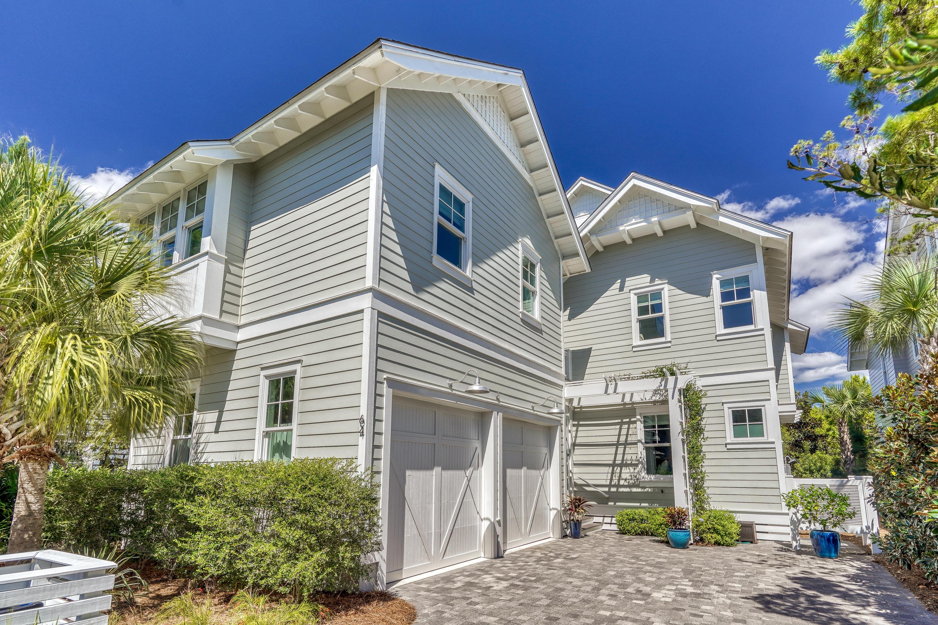 This immaculate, professionally-designed and decorated home invites comfort, and exudes modern elegance. With over 3440 sq. ft of heated and cooled space and 1750 sq. ft of screened, covered and open decks, a lap pool and two outdoor fireplaces, this home is the perfect home for entertaining or relaxing and enjoying the coastal lifestyle.
Enter the home via the 450 sq. ft screened porch featuring Taby fireplace, gas logs and plenty of space to lounge, dine and watch your favorite game.
The spacious living room has 10 ft ceilings, ample windows and natural light, wood beams and v-groove wood walls throughout,. Beautiful French doors lead out of the living room to the 375 sq. ft covered deck and the lap pool, blending the indoors and outdoors in perfect harmony. The gourmet kitchen features quartzite countertops, Thermador 36" stove, vent hood and refrigerator, Kitchenaid wine cooler and ice maker. The main level also offers a guest bedroom, ensuite bath with dual vanities, extra deep soaking tub and a separate shower.
The second level features the Master bedroom with vaulted ceilings, wood beams and ample natural light leading out to a private 375 sq.ft open deck. The Guest bedroom, guest bathroom and media room with 4 bunk beds leads out to an additional 460 sq. ft open deck with a Taby fireplace fitted with gas logs, another great gathering spot. The carriage house with a full kitchen, seating area, bedroom and bathroom offer a very private option for guests. 
The third level is the perfect sanctuary to get away for some work, reading, or just taking in views of the Gulf.
Uniquely located, this lot borders the community boardwalk and puttering park, one of the few lots in the community offering this level of privacy. 
WaterSound Beach is a gated community located on the southside of Scenic HWY 30A, nestled between Deer Lake Park, Camp
Creek Lake and Point Washington Forest. The community offers 24 Hour Security, 1 mile of Sugar White Sandy Beaches and
Emerald Waters, Towering Dunes, Community GYM, Golf Cart Paths to the Beach and more. Make an appointment today to view
this one of a kind property.