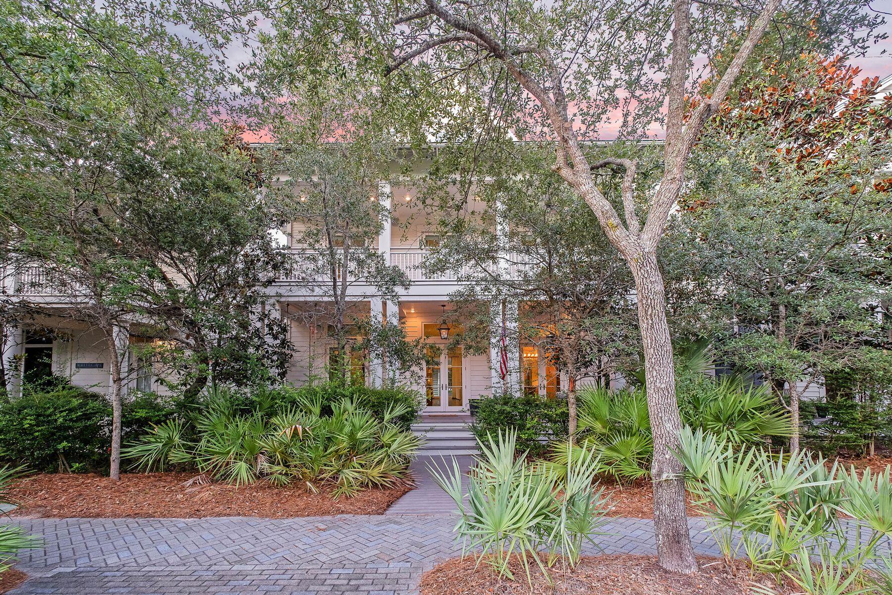 This WaterColor beach house has it all —  a private pool and carriage house, two master suites, a game room and a bunk room. It even includes a six-seat golf cart for getting around. Set behind a low hedge and screened by mature trees, this awe-inspiring residence on ''President's Row'' enjoys an unbeatable location. It's just blocks from the beach club, Camp WaterColor, Western Lake boathouse and 30A attractions. A decked front porch welcomes you with two swing benches for lazily watching the world go by. Indoors, the light and airy interiors feature white shiplap walls, contemporary lighting fixtures and sleek hardwood flooring. The huge open great room is perfect for entertaining with a seamless flow between multiple breakfast, formal dining and sitting areas. Sofas are grouped for conversation after enjoying a meal with family and friends. A large marble-topped island demarcates the gourmet open kitchen, which is brimming with high-quality cabinets and stainless steel appliances. A six-burner stove, wine refrigerator and an icemaker are some chef-worthy aids. Six well-proportioned bedrooms include a spacious first-floor master suite with tall windows introducing abundant natural light. Six full bathrooms and a half bath showcase modern white fixtures, including frameless glass showers and a deep roll-top tub. Along with a four-bedroom bunk room, the home delights young guests with a third-floor bonus/game room. There's heaps of space for playing pool, ping pong and other favorite games. Located above the two-car garage, the well-appointed carriage house is accessible from a second-floor walkway. It provides guests and independent family members with their own luxury pad. The compact kitchen is fully equipped to prepare snacks and meals, which can be enjoyed at the breakfast bar. A sitting room, bedroom, full bathroom and a laundry closet complete this well-appointed retreat. Head outdoors to the private pool area to find ample space for relaxing in front of the open fireplace. The second-floor porch offers another quiet space for reading and enjoying the sound of songbirds in the treetops. Recent updates include a new pool heater and pump along with Wi-Fi and audio-visual upgrades. This exceptional Phase I WaterColor home is in an unbeatable location, just a short hop from the beach, Town Center and 30A shopping and dining. Boutiques, restaurants and entertainment at neighboring Seaside, Florida, are all within easy walking distance.