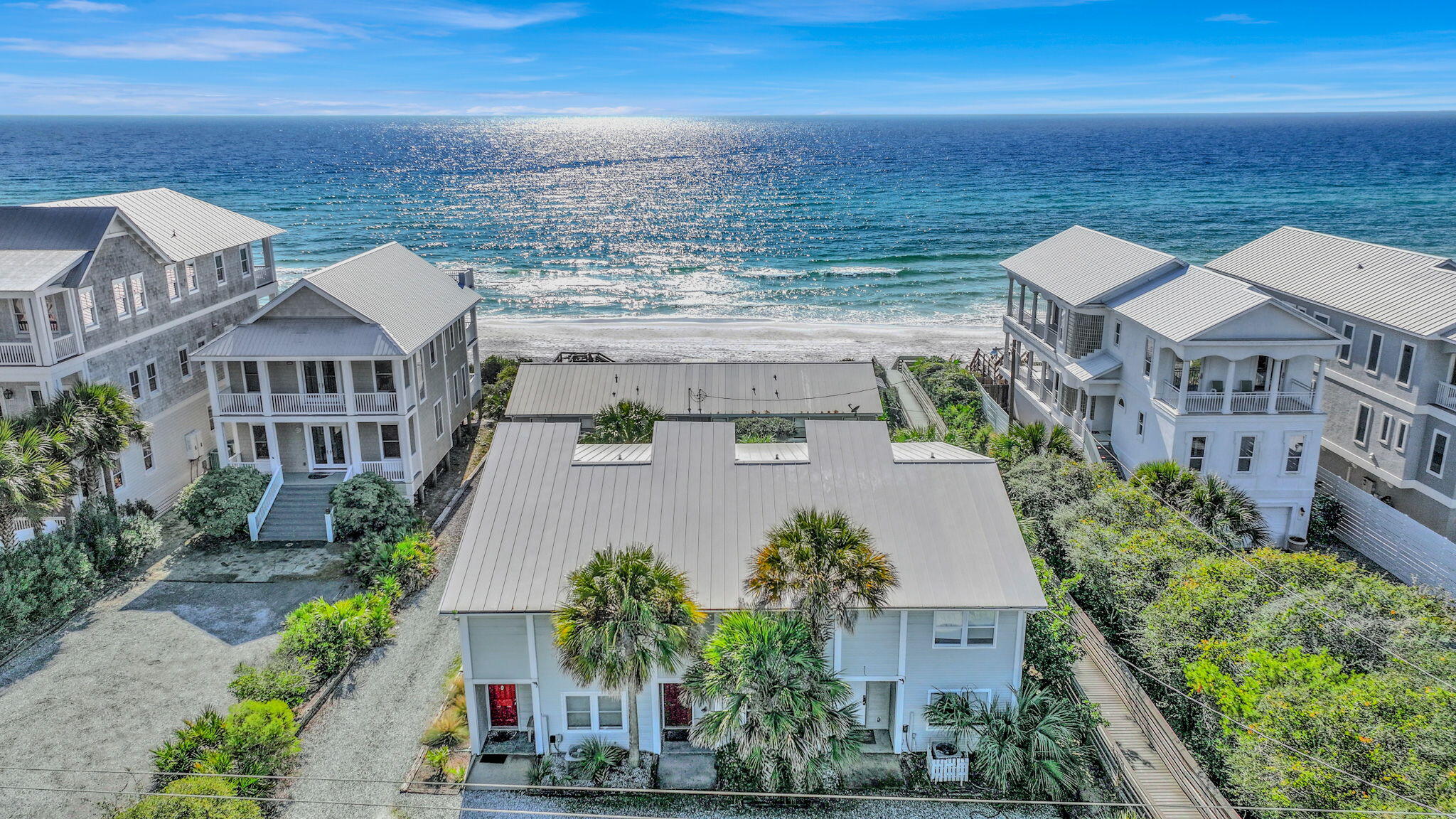 Price Adjustment!! Welcome to your Southside 30A retreat, ideally positioned just steps from the Gulf with private beach access via a dedicated boardwalk, no HOA, and short-term rental flexibility. This thoughtfully updated 3-bedroom, 3-bath residence offers a rare combination of coastal privacy, modern comfort, and lifestyle versatility. The home features granite countertops, stainless steel appliances, and new luxury vinyl plank flooring throughout, blending durability with understated coastal style. A functional layout provides abundant storage and comfortable living spaces designed for both everyday use and hosting guests. Outdoor living is enhanced by multiple inviting spaces, including a newly built deck with Gulf views, ideal for morning coffee or sunset evenings, along with a screened-in porch perfect for enjoying coastal breezes year-round. Ample parking adds everyday convenience for owners and guests. Located on the south side of Scenic Highway 30A, this residence places you moments from the sugar-white sand and emerald waters, with easy access to Seaside, Alys Beach, Rosemary Beach, and Watersound, as well as nearby boutique shopping, casual cafés, and renowned local dining. Offering private beach access, thoughtful updates, no HOA, and a coveted Southside 30A setting, this home delivers a seamless blend of coastal lifestyle, convenience, and flexibility.