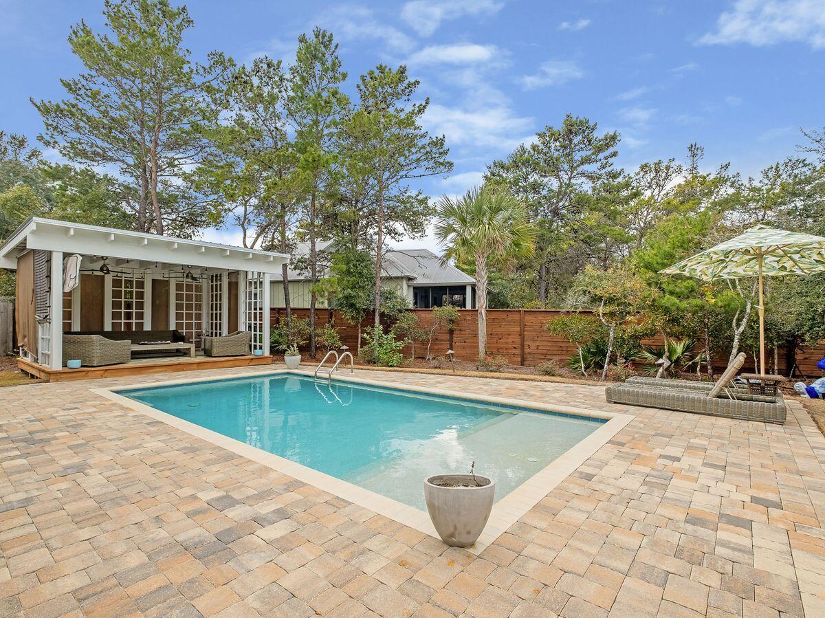 Live the 30A lifestyle in this like-new, never been rented beach home completed in 2018 that features a sizable swimming pool, custom made loggia, outdoor kitchen and deeded beach access at the end of the street. This five-bed, four-and-a-half-bath beach retreat boasts more than 3,300 square feet of living space with a private pool surrounded by a fenced yard and convenient one-car garage with additional storage space. This home is a perfect fit for someone looking for a primary, secondary or rental investment property; offering gross annual rental projections ranging from $150,000-$200,000+. On the first floor, the kitchen features an oversized island with breakfast bar, quartz countertops, walk-in pantry, and custom cabinetry near the dining area with additional seating. The first-floor owner's suite is complete with soaking tub, walk-in shower, his-and-hers vanities and walk-in closet. Additional guest accommodations have ample closet space and adjacent baths. A media and entertaining area as well as a loft with viewing deck are available on the third floor. The outdoor living space is a hallmark of this property with a screened porch, summer kitchen and in-ground pool. White's Gulfview Estates is perfectly positioned on the east end of Scenic Highway 30A, in close proximity to Alys and Seacrest Beaches as well as Highway 98. Located directly off 30A, enjoy endless dining, shopping, attractions and local events nearby.