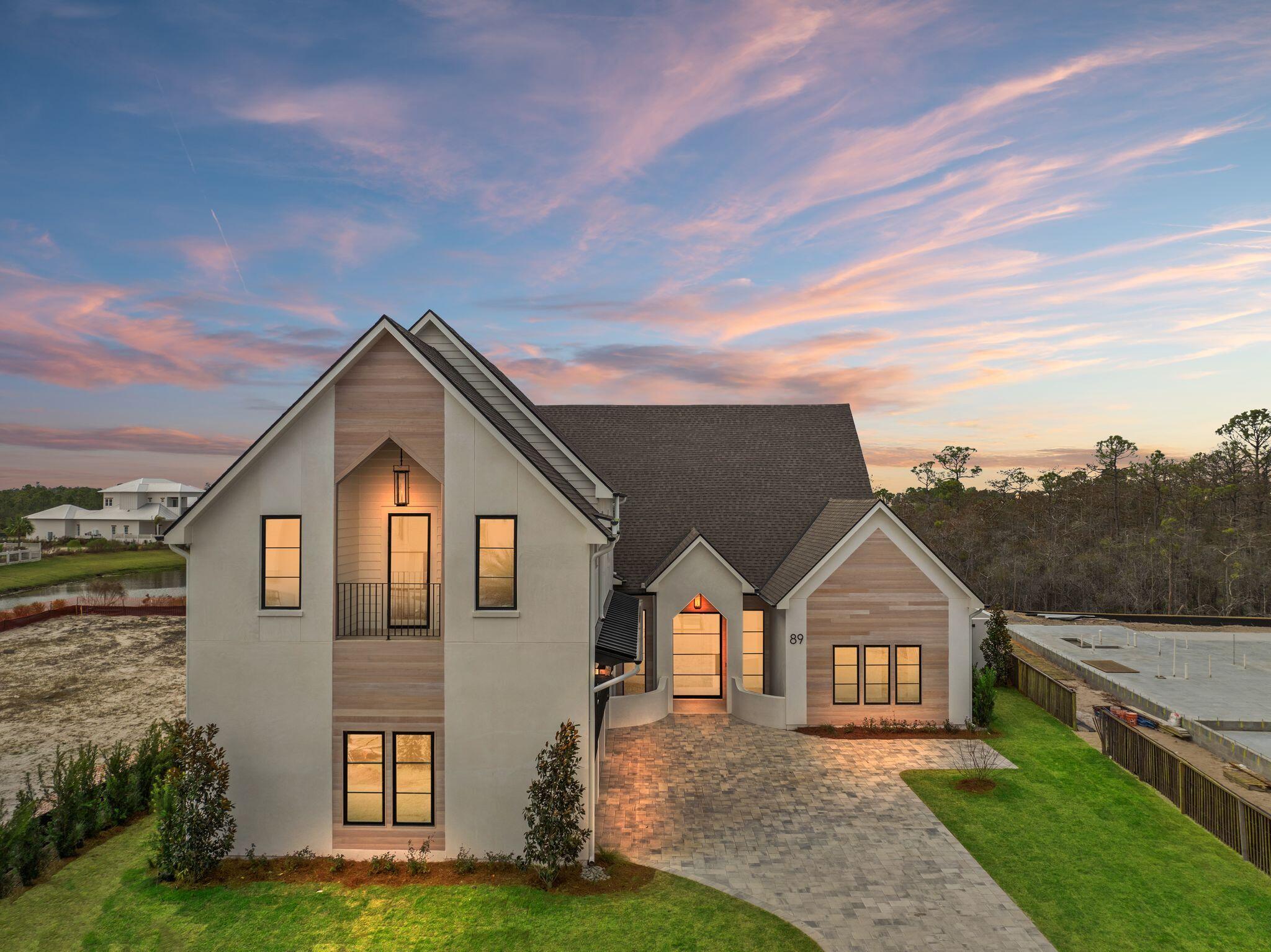 Welcome to your custom dream home in the exclusive Watersound Camp Creek community. This beautifully designed 5-bedroom, 4.5 bath residence located at 89 Quail Hollow Court offers the perfect blend of luxury, functionality, and coastal charm boasting 4386 sq ft. of living space.  

Step into an open-concept floor plan featuring 16-foot ceilings in the family room/kitchen and 12 ft. ceilings throughout.  The home will have expansive wood floors, and large windows that flood the home with natural light. The chef's kitchen is a culinary masterpiece, outfitted with high-end appliances, custom cabinetry, and an adjoining scullery—ideal for entertaining and effortless meal prep. The thoughtfully designed layout includes three spacious bedrooms on the 1st level, including the luxurious primary suite with spa-inspired ensuite bath and an oversized closet. On the 2nd level, you'll find two additional bedrooms, a versatile media, living space, and a convenient kitchenette perfect for guests or multi-generational living. 

Every inch of this home showcases top-of-the-line designer finishes and craftsmanship.  The location within the community offers close proximity to the amenities with ultimate privacy having a forest in the rear which will never be developed.   The home is currently under construction with an estimated completion date of Feb. 2026.  The builder welcomes input from the buyer on customization of final finishes.  

Owners in Watersound Camp Creek enjoy an exclusive level of membership to The St. Joe Company's Watersound Club. This entitles you to direct access to the club amenities at Camp Creek including resort pools, an 11,000 square foot fitness center, tennis and pickleball courts, multiple private dining venues, and Tom Fazio designed golf course. Other member benefits include the Watersound Beach Club amenity center with complimentary gulf-front chair and umbrella service. Members also enjoy golf at the private Shark's Tooth course at Wild Heron and The Third, the club's newest course.