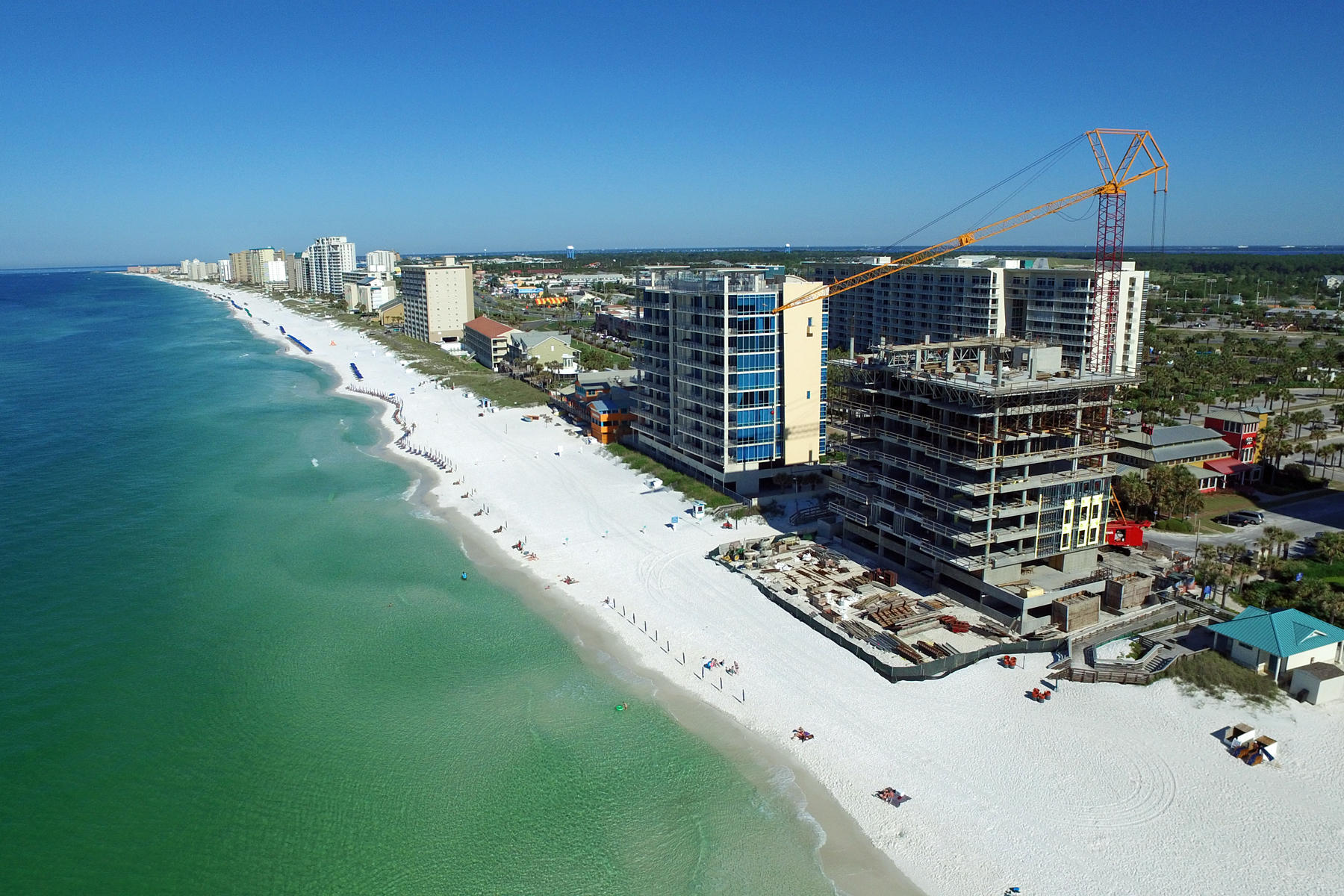 1900 Ninety Eight is Destin, Florida's first Gulf front condominium developed since 2007. This two story luxury penthouse features panoramic view of the Gulf of Mexico from its two story living room with an expansive wall of floor to ceiling windows as well as its two private balconies. The first floor balcony is equipped with an electric grill while the second floor balcony is enjoyed exclusively by the master bedroom. The open plan with clean, flowing lines invites beams of natural light inside. Special to the penthouse is a first floor media room. The penthouse features a private elevator inside the penthouse itself which allows for unparalleled access to each of its exquisitely designed rooms. Interior design elements feature custom cabinetry, quartz and marble countertops, Thermador kitchen appliances, KitchenAid ice maker and wine cooler, and porcelain stone floor tile. This two story, four bedroom, four bath penthouse is truly incredible. Amenities include a rooftop pool, spa, fire pit and state of the art fitness center, along with gated entry, heated and cooled elevator and lobby areas and two levels of parking beneath the residences.