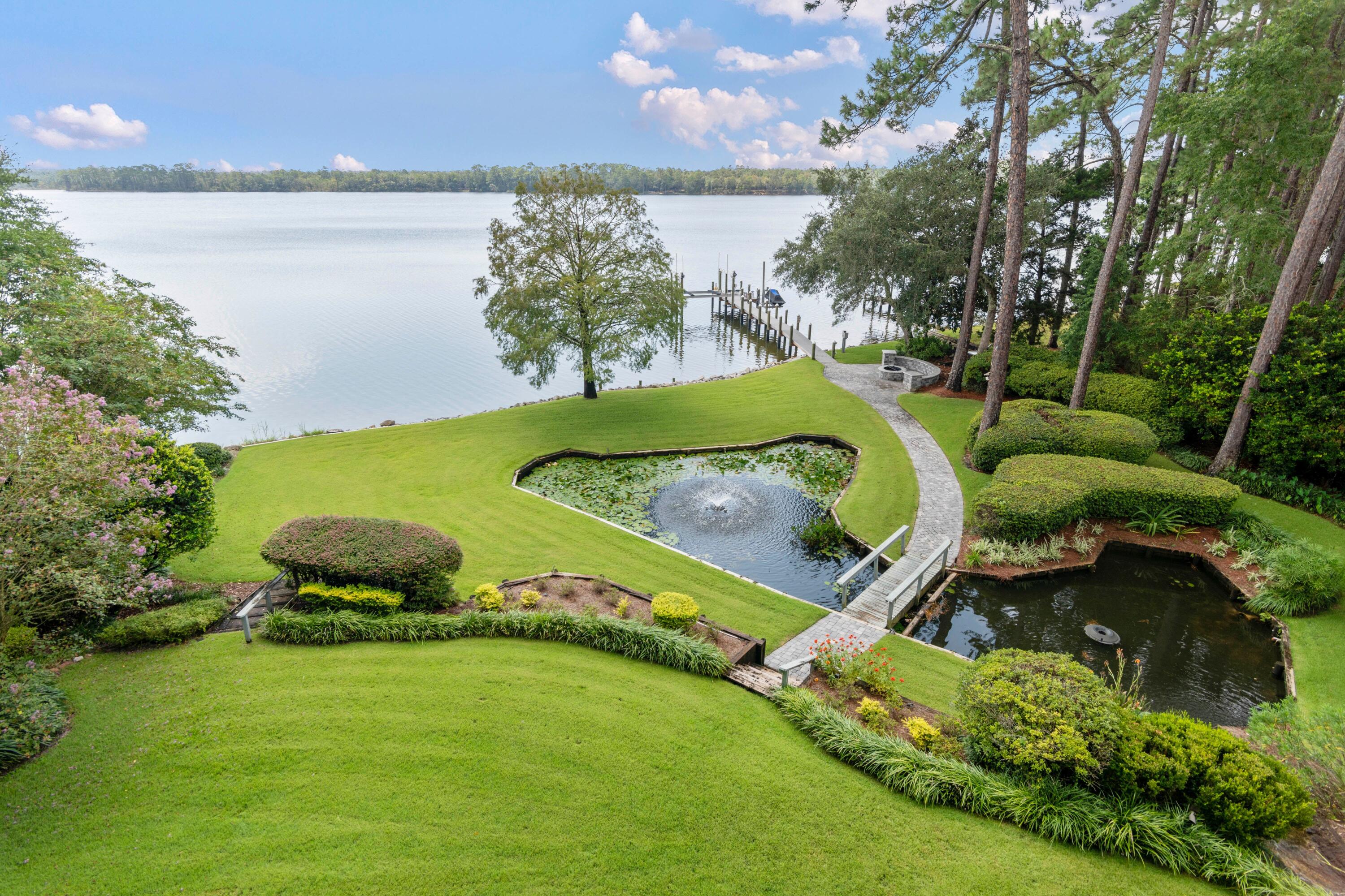 This newly renovated Estate property is perfectly oriented on a 1.1acre waterfront oasis.  This estate is located on the aquatic preserve area of Rocky Bayou across from Fred Gannon state park.  The property features 6 bedrooms and 4.5 bathrooms.  Wolf/Subzero appliances including 60' double oven, warming drawer, Ice maker, Wine refrigerator. Massive entertainers kitchen and island with panoramic water views. Large infrared sauna in master bath, Tall ceilings, wood burning fireplace with gas starter for easy transition. Remodeled basement apartment that can act as a mother-n-law quarters. Outdoor kitchen is equipped with a stainless grill and storage. Straight-Line Marine dock with thru flow decking, power, and 20,000 pound boat lift.  Swinger jet ski lift. Outdoor firepit area offers views of the bayou and plush landscaped aquifer fed waterfall. The Entire property has mature landscaping accompanied with professional landscape lighting that also highlights the 200yr old oak trees as you enter the property. There are 2 beautiful ponds with fountains. This is a must see! Buyer to verify all dimensions.