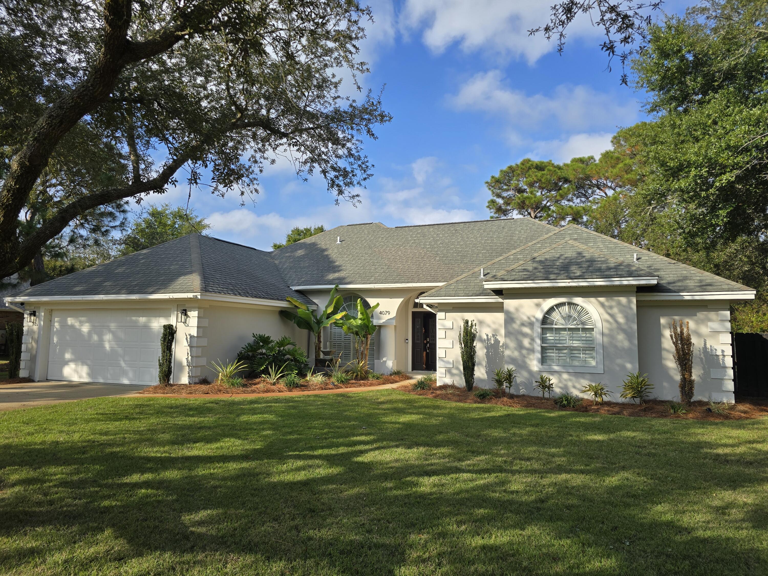 Welcome to 4079 Burning Tree Drive, a rare opportunity to own in one of the most desirable neighborhoods in Destin.  A beautifully maintained 3-bedroom, 2-bath home offers a relaxed coastal lifestyle with spacious living areas and modern finishes. Enjoy an updated kitchen with gas fireplace, cozy breakfast nook, plus a primary suite with his and her walk-in closets and spa-like bath. Step outside to a screened-in pool and peaceful backyard—perfect for year-round entertaining. Located minutes from beaches, shopping, dining, and Destin Commons, this home blends comfort and convenience in a highly sought-after community. 2.38% Assumable VA Mortgage! Roof is 2011, HVAC 2015, Water heater 2020. Schedule your showing today!