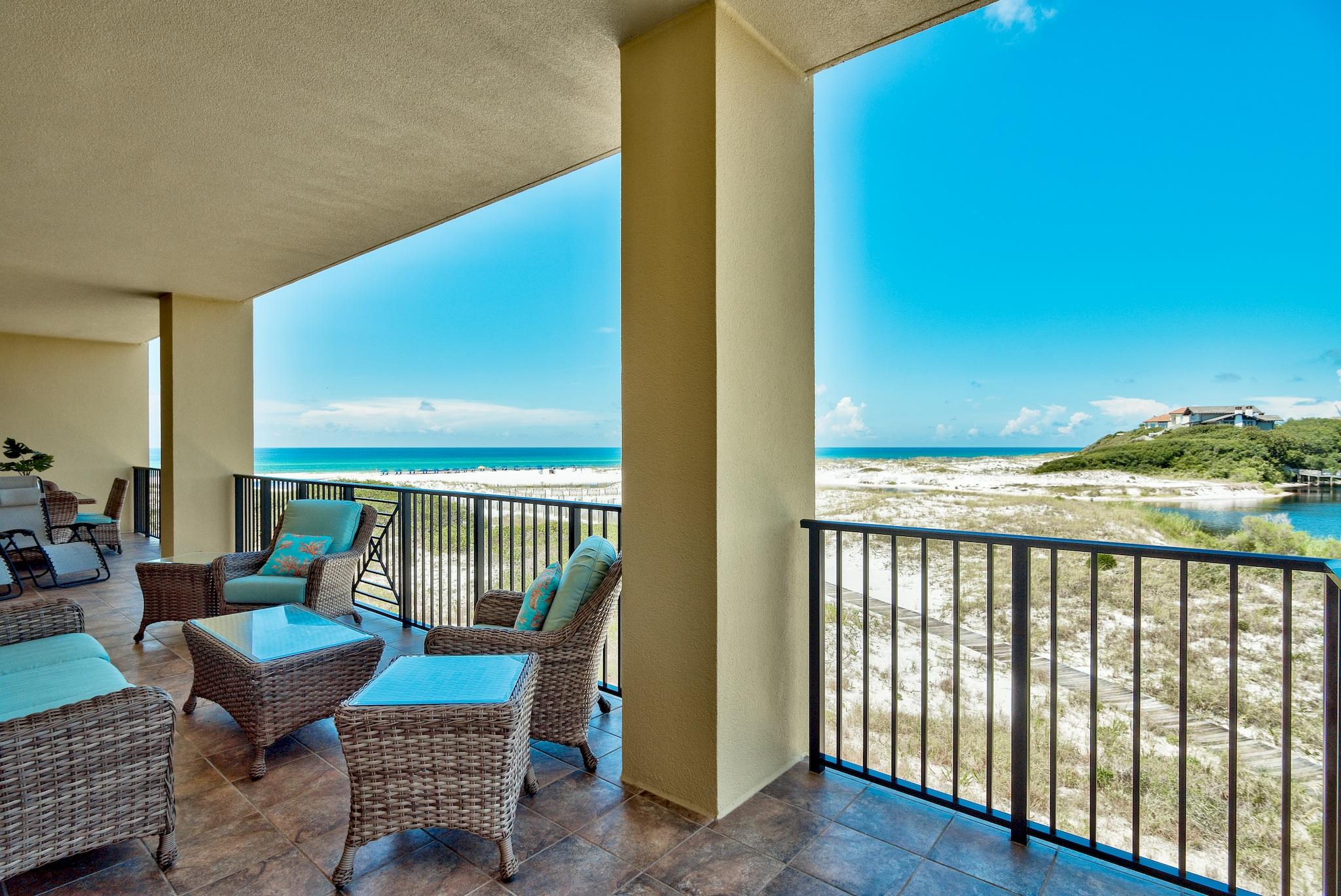 Glorious and Rare Gulf Front and Lake Front views from the balcony of this unit...what a rare find on Highway 30A!! This 4003 square foot home at Sanctuary by the Sea has five bedrooms, four & one half baths, and 460 sq ft of balcony. This unique floor plan offers two luxurious gulf front master bedroom suites with entrance onto the balcony. No feature is overlooked in this beautiful condominium residence. The home is fully furnished and provides great access to the gulf-side pool, Redfish Lake, and two dune walkovers. Call today to schedule your private appointment to view this lovely condo! Sanctuary by the Sea offers an unmatched coastal lifestyle with Beach and Coastal Dune Lake frontage, three  community pools, covered parking, fitness center and gated entry all located on the South side of Highway 30A between Blue Mountain Beach and Grayton Beach and walking distance to local shops and restaurant.  SBTS offers a haven of serenity and privacy unequaled with only 82 condominium residences on 23 secluded acres nestled by over 1,500 ft of frontage on Big Red Fish Lake and fronting 650 feet on the Gulf of Mexico.  Within  the Mediterranean style stucco exterior, luxury is a standard; every residential unit offers 10' ceilings, wide crown molding & 7'' baseboards, 8' doors, gas fireplace, wet bar, tiled balconies, travertine tile in dining, living, baths & laundry. This lush private setting with a poolside waterfall is complemented by diverse amenities including underground parking, 4X10 storage cages, three sparkling pools, gas fire pits, poolside grills, fitness center, lakeside canoeing, movie theater, video game area, owners lounge and virtual golf.