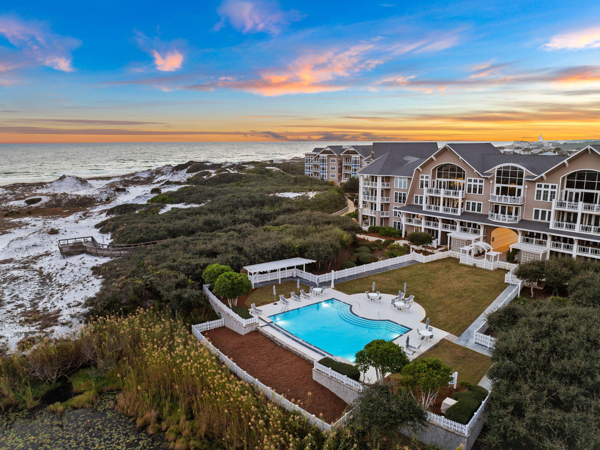 Overlooking the emerald waters of 30A and listed well below appraised value, welcome to Compass Point, a luxury waterfront condo in the heart of Watersound Beach. This two-story condo, designed by Graham Gund, was recently remodeled with Viking & Liebherr appliances, polished marble, refinished cabinets, a new water heater, and more. The first floor includes a spacious primary suite with screened porch, garden tub, garage (unique to this unit), office, and bunks. Upstairs, enjoy a gourmet kitchen, wet bar, and covered porch with stunning Gulf & dune views. Designer furnishings and golf cart included. Located between Deer Lake State Park and Camp Creek Lake, walk to the St. Joe Beach Club or drive 1.8 mi to Camp Creek Golf. Enjoy deeded beach access, 2 community pools, and more. Show now!