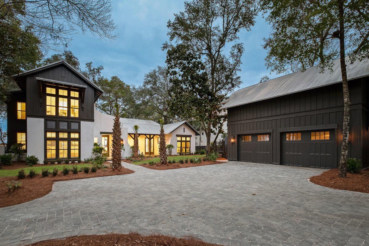 Experience unparalleled privacy and naturalistic serenity from this exemplary legacy offering located in the gated enclave of the Estuary, one of the most exclusive locations along the Emerald Coast surrounded by state forest land. 135 Ansley Forest Drive has been beautifully and thoughtfully updated, yielding an elegant and refined bay front retreat characterized by timeless finishes and pristine bay views offering over 100' of private water frontage perched at a high elevation in the favorable X flood zone. This home was beautifully designed by Tammy Massey and masterfully built by Arkon utilizing concrete block construction on the first level and notably offering a full detached carriage house and oversized two car garage + storage. Other notable features include all new landscaping and hardscape as well as a newly installed brick paver driveway in addition to fresh interior and exterior painting, newly remodeled kitchen, master bathroom, laundry room and master office space resulting in a pristine color palette and sophisticated interior design with professional decor curated by Marisol Gullo. This beautiful home offers a private pool and adjacent pool house as well as a covered dock and excellent boat & watersports storage. The sprawling master suite is located on the main level and offers charming vaulted ceilings in addition to the vaulted ceilings and floor to ceiling windows that are consistent throughout the primary living spaces. The adjoining master bathroom has been refunctioned and strikingly outfitted with an oversized dual vanity, free standing soaking tub and floor to ceiling large format tile in both the common space and the frameless glass shower. The master suite also offers a large walk-in closet with custom built-ins and ample storage. There are five total bedroom suites including the carriage house as well as multiple flex spaces for an in home office or fitness room. The first level offers two bedrooms plus an office / fitness space. The chef's kitchen is also located on the first floor and features newly installed sleek stainless appliances with custom cabinetry and quartz countertops open to both the spacious living room and the easily accessible outdoor patio. The covered porches and floor to ceiling windows are consistent on both the north and south elevation allowing ample natural light to cascade throughout the home as well as unimpeded views over the Choctawhatchee Bay. The second level offers two large bedroom suites, each with their own ensuite and offering gorgeous north facing bay views. This homesite is one of the most exclusive offerings in the marketplace and will allow a true estate experience with ample privacy and mature natural landscaping including century old oak trees and endless access to a coveted waterfront lifestyle. The Estuary is tastefully nicknamed "30A on the Bay" with timeless coastal architecture and stately homes along the water. This premium location allows great boating access as well as perfect positioning with quick access to Scenic highway 30A and all the world class restaurants, boutique shopping and local entertainment that south walton county is so famous for.