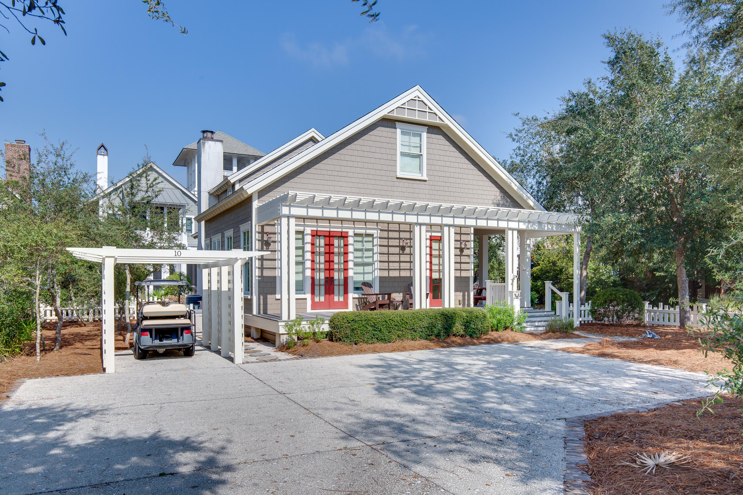 JUST REDUCED by $150K!!  A quintessential Florida Cottage, inside the gated community of Watersound Beach, on a premium corner lot with plenty of space to add a Carriage house and pool. The 2 large wraparound porches and a short distance to the most desirable beaches offers the perfect beach lifestyle. Large back porch overlooks a community boardwalk that takes you to the white sandy beaches of the Gulf of Mexico. The open floorplan offers 10' ceilings downstairs, 9' ceilings upstairs, with recessed lighting, hardwood floors, crown molding, exquisite millwork with 6' baseboards and custom shades/curtains throughout. The gourmet kitchen features newer KitchenAid appliances installed in 2018, granite countertops, upgraded cabinets, an oversized island and under cabinet lighting. The dining room features plenty of windows and a custom chandelier with views of the back yard and deck. The living room offers an open concept plan, a gas fireplace, tons of natural light and plenty of space to spread out and enjoy together time with the family. The master bedroom boasts plenty of natural light and double doors leading out to the picturesque front porch. The master bath has upgraded tiled floors, dual vanities, step-in shower with upgraded tile and rimless glass shower door, garden tub and upgraded fixtures. Additional 3 bedrooms offer great flexibility, each with an ensuite bathroom with fully upgraded tiled floors, granite countertops, tiled showers and rimless glass shower doors. Additionally, a built-in desk and cabinets in the upstairs hallway and extra storage areas provide even more flexibility. The laundry room features builtin cabinets, a bench and counter space. The driveway has enough space for 3-4 cars and a golf cart space - plus the lot has enough room to add a carriage house, pool, cabana, etc. The expansive, wraparound back porch features a porch-swing, with views of the easy-to-maintain, beautifully designed, mature landscaping and a serene, community boardwalk that leads you straight to the beach. Alarm system already installed which can be activated/monitored and a Sentricon termite bait system. Located in the Dune Ridge area of WaterSound Beach with all mature landscaping, multiple parks and green spaces, nature areas and all nearby houses already constructed for the ultimate in quiet, quaint living. WaterSound Beach is located on the southside of Scenic HWY 30A nestled between Deer Lake Park, Camp Creek Lake and Point Washington Forest. This exclusive community offers 24-Hour Security, 1 mile of Sugar White Sandy Beaches and Emerald Waters, Towering Dunes, Community GYM, Golf Cart Paths to the Beach and more. To truly appreciate this GORGEOUS home call today to schedule a private showing!