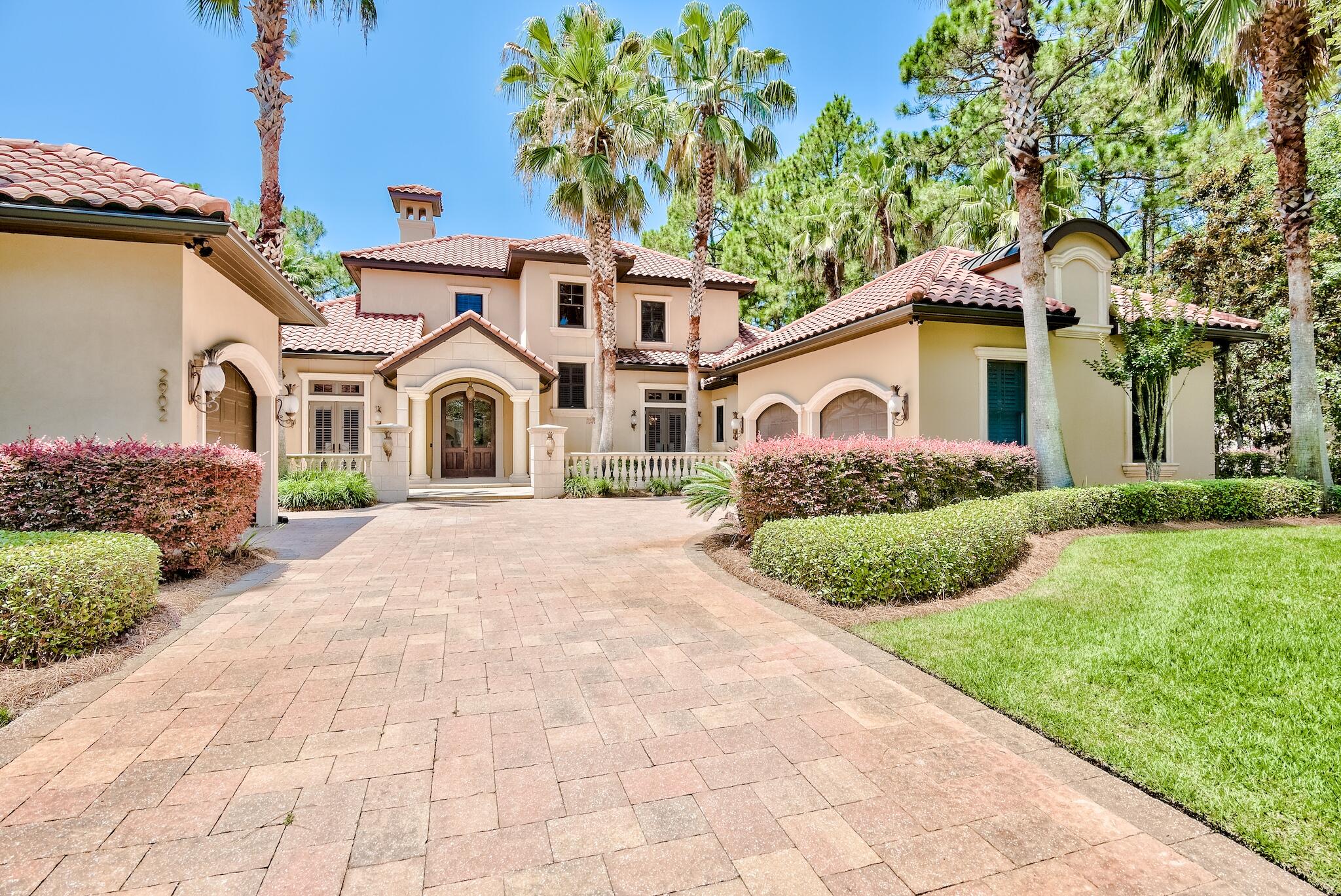 Phenomenal custom built home in the exclusive community of Burnt Pine on an expansive lot totaling over 1/3 acre. This property offers privacy and serene views of the golf course and pond. Home is perfectly situated on the 6th fairway of the Burnt Pine Club golf course and offers plentiful outdoor spaces including a screened-in lanai, salt water pool, hot tub, incredible summer kitchen, patio and wraparound balcony. There is fantastic curb appeal with beautiful landscaping, paver stone driveway and custom exterior lighting. The interior features exquisite finishes and architectural details throughout. Tiered tray ceilings, glass blown chandeliers, intricate mosaic tile work, beautiful travertine and hardwood flooring and custom built-in shelving and cabinetry set this home above the rest! Enter the home through beautiful double wood doors and a stunning foyer with a delicate glass blown chandelier and custom mosaic tile. Tray ceilings, layered crown molding and elegant archways show the true craftsmanship and attention to detail. There is a formal dining area and additional seating at the oversized granite breakfast bar. There is an incredible Chef's kitchen that is generously sized with ample custom cabinetry and top of the line Thermador appliances including Wolfe 8-burner gas range, additional oven & warming drawer and Fisher Paykel dishwashers. The cabinetry is beautifully refinished with intricate details & trim, soft close drawers and refrigerator panels for a seamless look. The open kitchen flows into a quaint sitting area with mosaic flooring which is a nice addition while entertaining. The distinctive grand ceiling is a focal point of the living area and there is nice natural light with the large windows and retractable sliding glass doors bringing the outside in. Enjoy outdoor dining with a picturesque backdrop and the convenience of a covered and screened-in lanai, complete with a fan. Just past this is the phenomenal pool that can be heated seasonally to enjoy year round. There is unique mosaic detailing within the pool and above the built-in grill. There are plenty of spots for true relaxation in the salt water pool with built-in lounge pad, stools, and waterfall as well as the hot tub loungers, covered patio and open patio for sunning. Entertain easily with the fantastic summer kitchen. There is a gated backyard but the lot also extends past the gate towards the golf course and on the west side of the home with a natural tree buffer. 

The lower level features a split floor plan with the master suite on the left side of the home for added privacy. The generous master suite features beautiful hardwood floors, tiered tray ceiling and chandelier. It offers direct access to the pool, hot tub and patio. The master encompasses a his & hers walk-in closet with custom built-in shelving and a fantastic ensuite bathroom with stunning tile work, mosaic detailing, two granite vanities, custom cabinetry and an incredible walk-in shower. Oversized shower features glass surround, rain shower and additional shower head and sprayer. There is an added walk-in steam & jetted bathtub with elaborate mosaic tile and elegant archways. There is a fitness area within the bathroom and the glass door shoe closet was previously a steam shower and could easily be converted back. A private study off the master suite has Mahogany built-in shelving and makes a great office. Also on the first floor is a nice guest bedroom with tiered tray ceiling with crown molding, beautiful tile floors and an ensuite bathroom with walk-in glass shower. On this side of the home is also the Butler's pantry, mini fridge, and laundry room with full size washer & dryer, pet washing station and ample storage. There is a breathtaking powder room on the first floor with custom zebra wood and pedestal sink along with unique faux painting. 

The second floor encompasses two guest bedrooms, media room (or additional bedroom) and incredible wraparound balcony. The bedrooms feature plantation shutters, hardwood flooring and two have direct access to the wraparound balcony. Imagine enjoying your morning coffee on the covered balcony complete with wet bar and fireplace. Enjoy pristine & tranquil views, beautiful sunsets and even cozy fires in the winter. There is a beautiful ensuite bathroom off the larger bedroom and a new full bath in the additional guest bedroom which is a great addition. The media room is a great lounge but can also be another true bedroom if desired. The home is also very efficient with updated LED lighting, three newer AC units, and a full Generator. You have plenty of parking with a 3-car garage plus and additional golf cart garage. Storage within the home is suburb with ample cabinetry, large laundry room and custom built-in's throughout. This is a true sanctuary and stunning estate. You are in a prime location within Burnt Pine backing up to the elite Burnt Pine Golf Course and in close vicinity to the Choctawhatchee Bay, along with easy access to the Baytowne Marina, designated SanDestin beach and emerald Gulf of Mexico. Burnt Pine is the exclusive, gated community of SanDestin Resort and offers many amenities, dining & entertainment options and of course the award winning golf course! Do not miss out on this incredible opportunity.