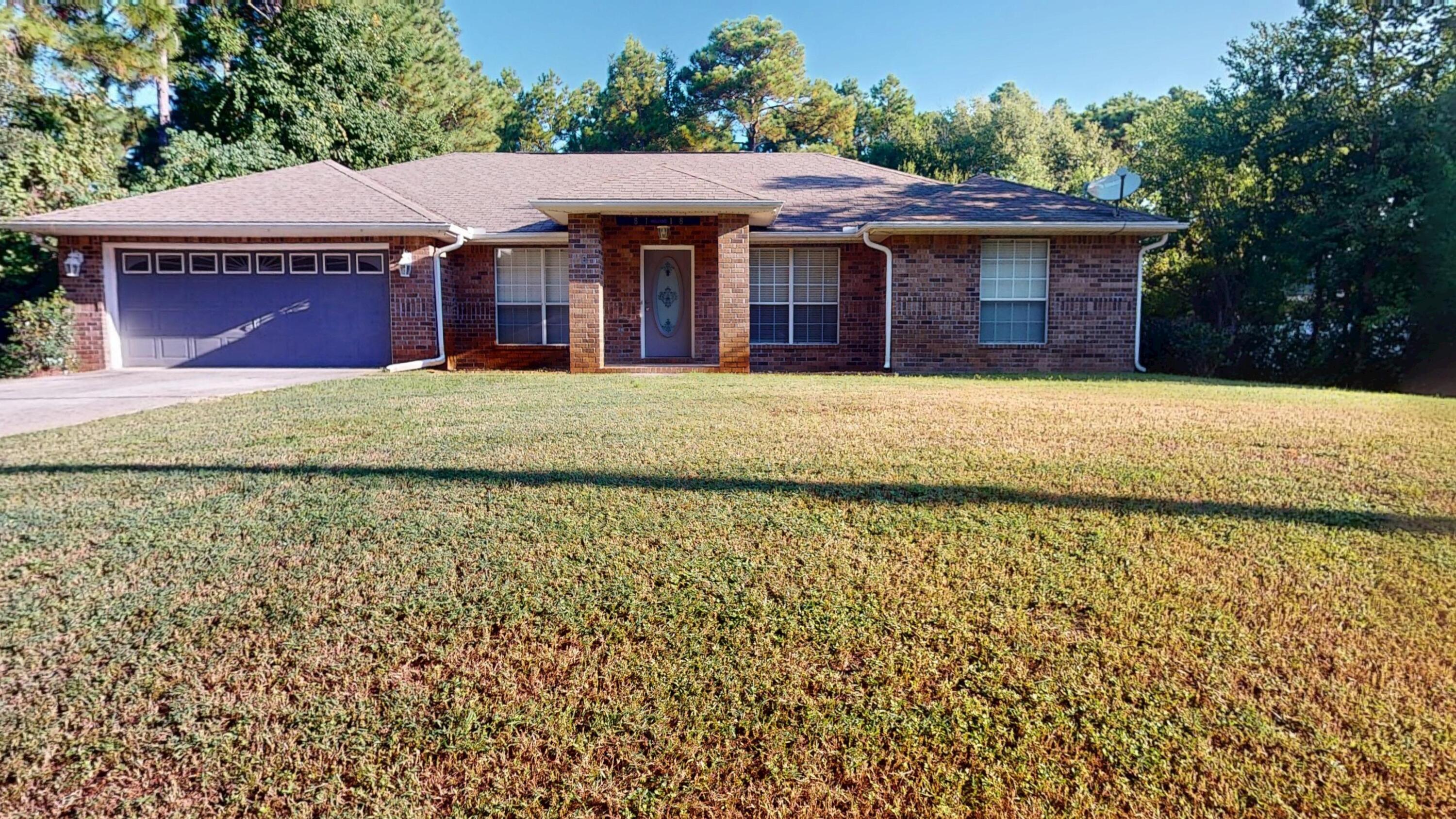 Welcome to your next home or investment property in Navarre!  It has four bedrooms with two full bathrooms and is move-in ready.  Spacious living room with a vaulted ceiling and a fireplace.  The open kitchen has plenty of cabinetry, as well as a breakfast bar that opens up to a quaint breakfast nook right off the kitchen.  A large separate dining room could double as a play area or an office space.  The Main Bedroom has a privacy on its own side of the house, with a tray ceiling and a large walk-in closet and an amazing master bath that includes double vanities, a large garden tub and a separate shower.  One of the remaining three bedrooms has a vaulted ceiling and could easily become a great office space.  New carpet and plank flooring, as well as a new AC unit.  The property is a slice of secluded heaven, bordered on two sides by a small creek, where catfish and trout can be found.  A patio is accessible from both the Main Bedroom and the Great Room, and the yard has plenty of room to add a pool, gazebo, or playground.  Close to Navarre schools.
